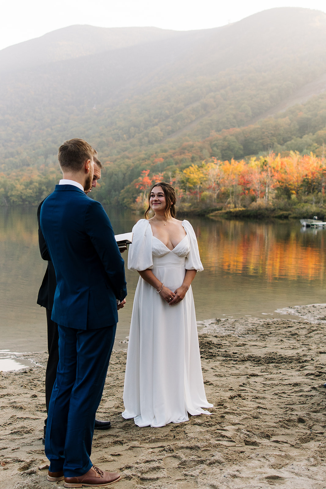 Bride and groom getting married by best friend at an intimate ceremony at Echo Lake state park