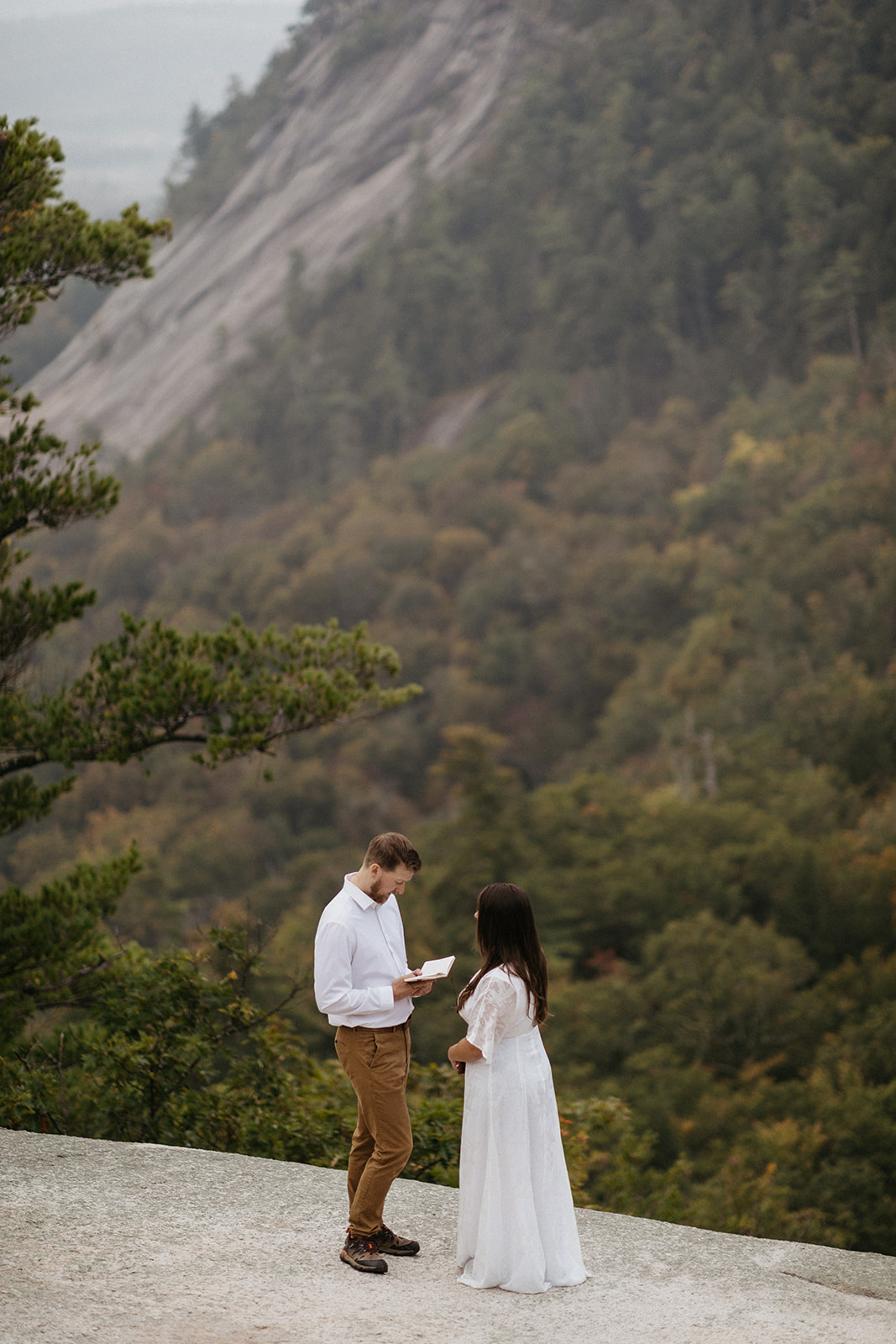 Couple reading private vows on Cathedral Ledge 