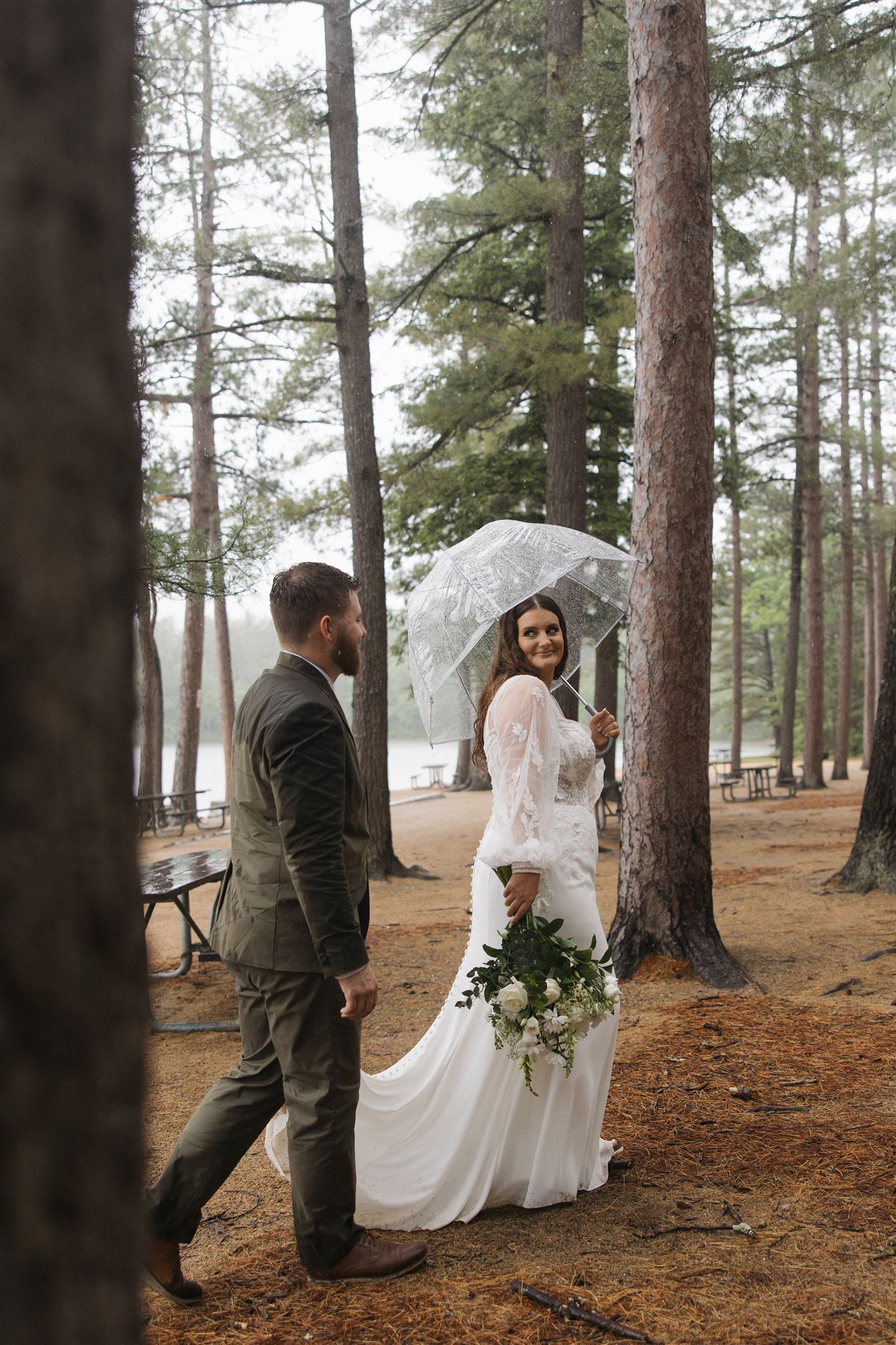 Couple walking through echo lake in new hampshire