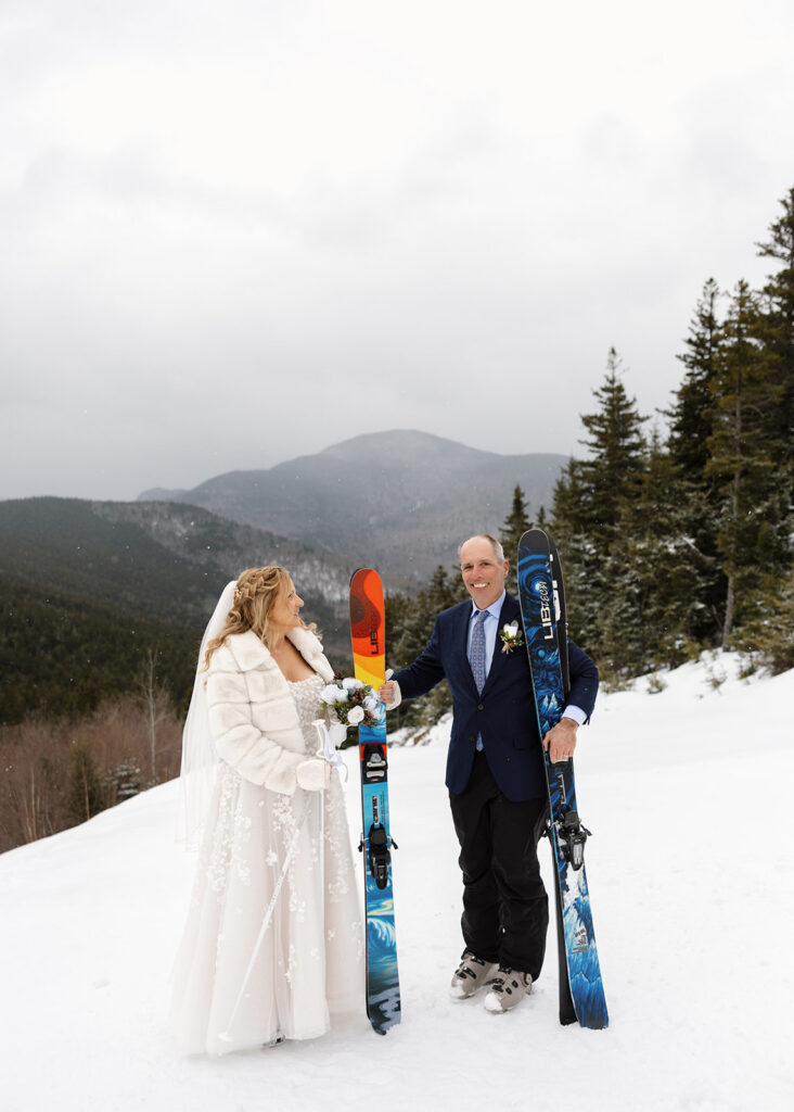 Bride and groom on skis at their winter elopement wedding at Bretton Woods, NH 
