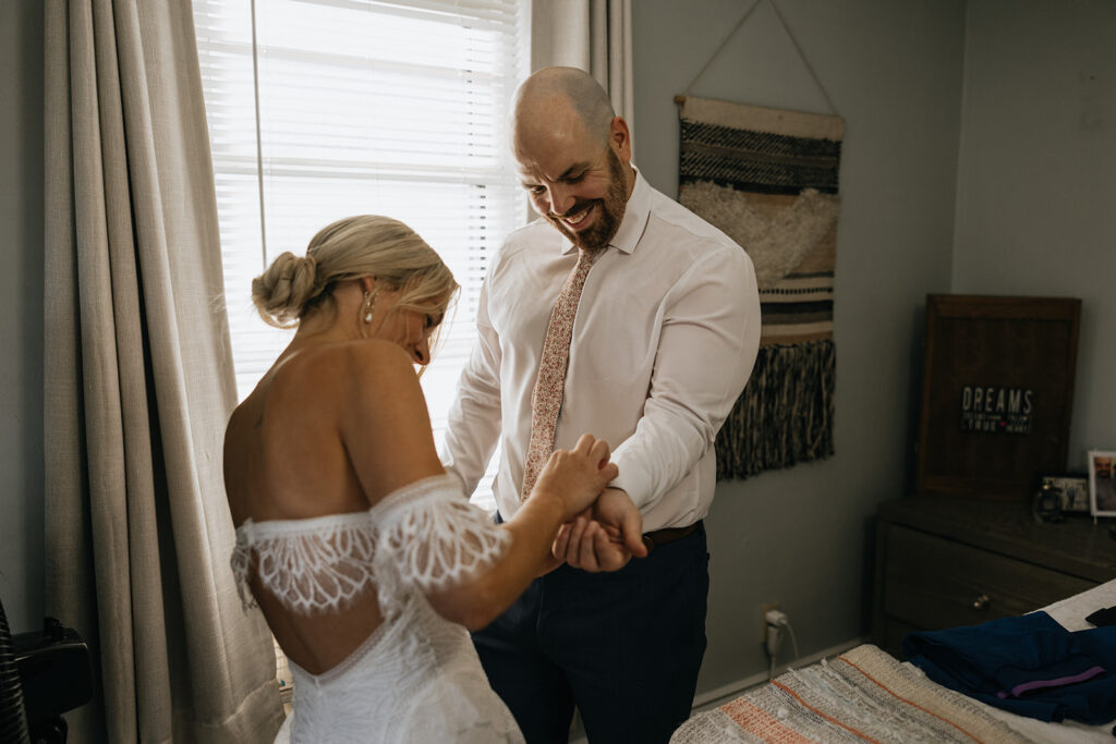 Bride and groom getting ready together in their home in Portsmouth, NH