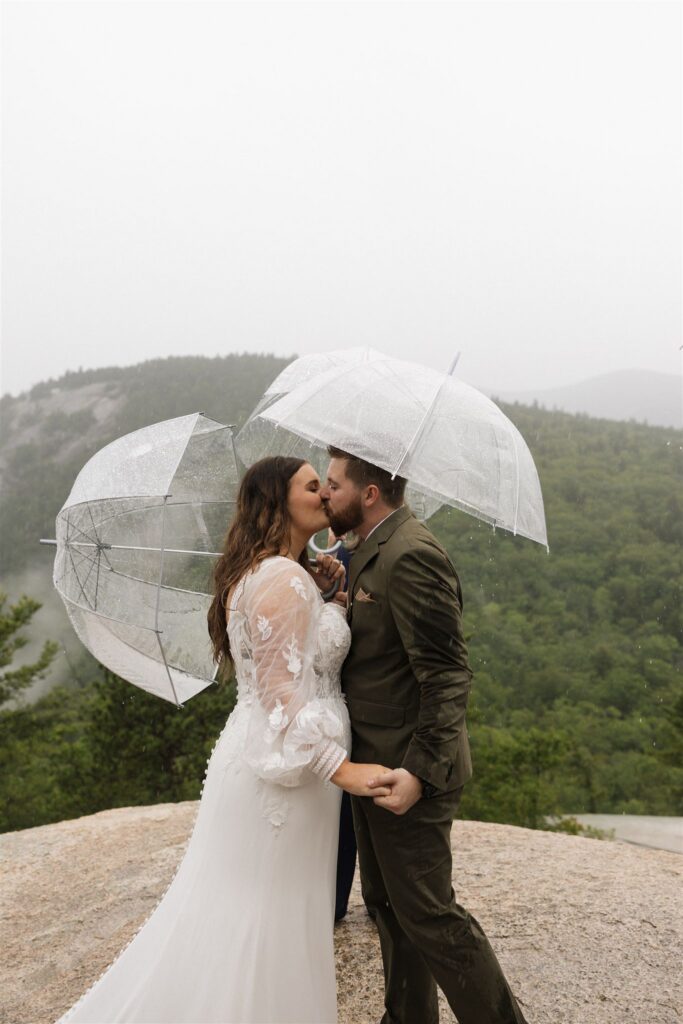 Bride and groom getting married in the rain at Cathedral Ledge in the White Mountains of New Hamspshire