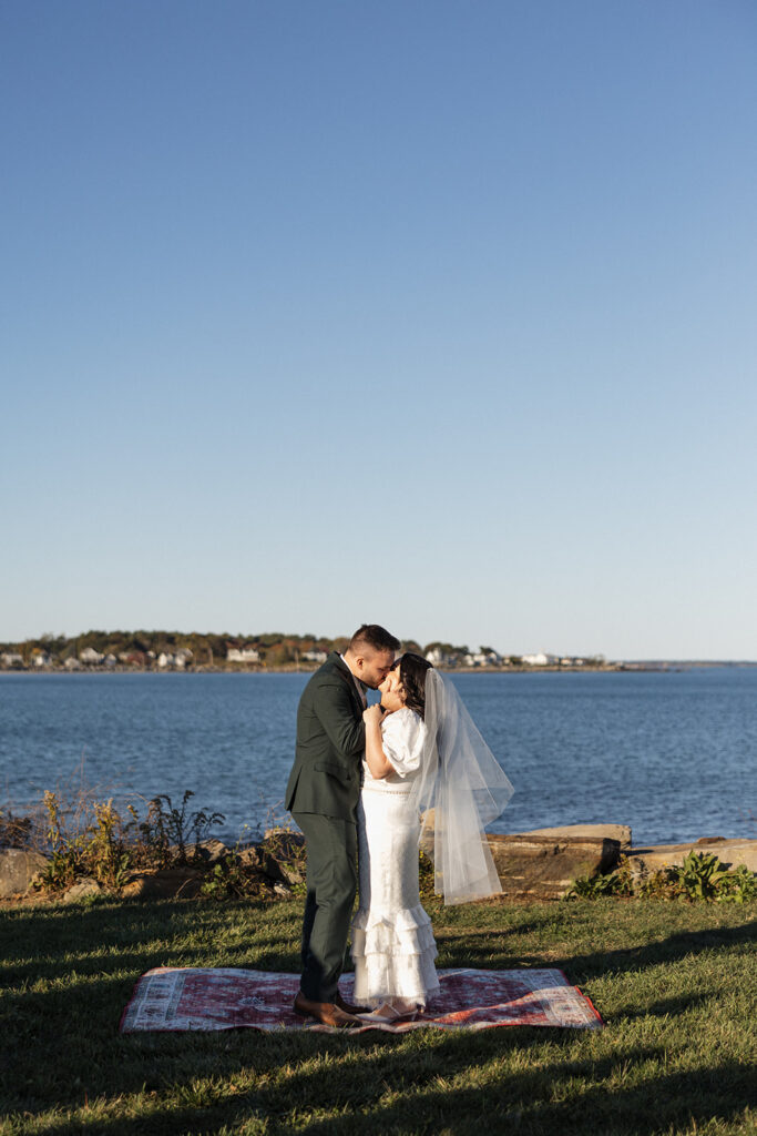 Couple saying vows at Rye Harbor State Park in New Hampshire
