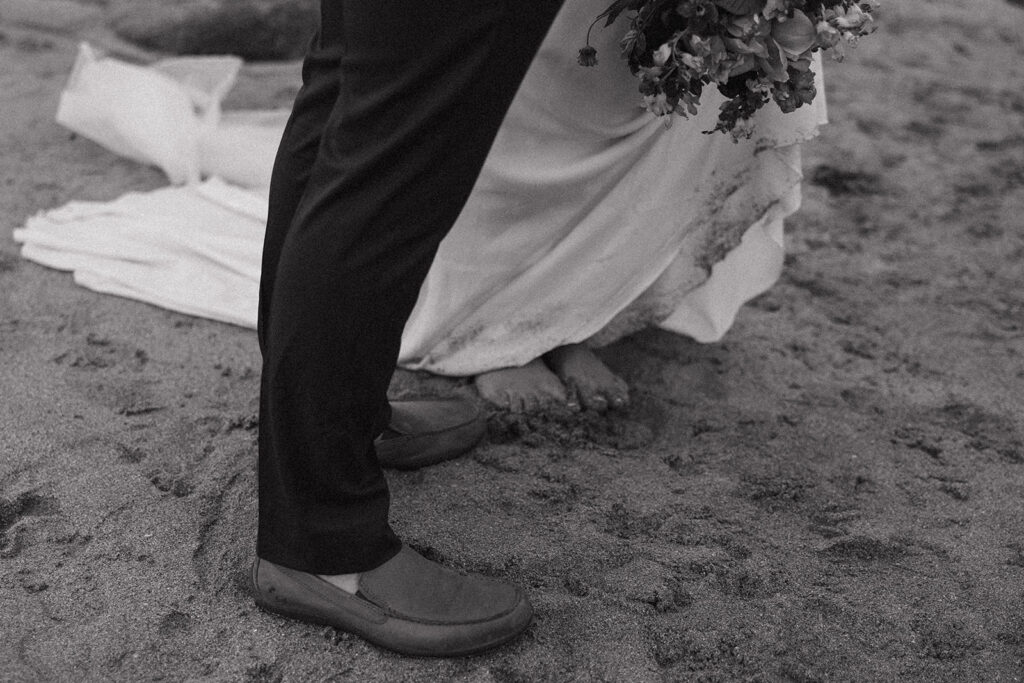 Cinematic black and white photo of an elopement couple in Acadia National Park