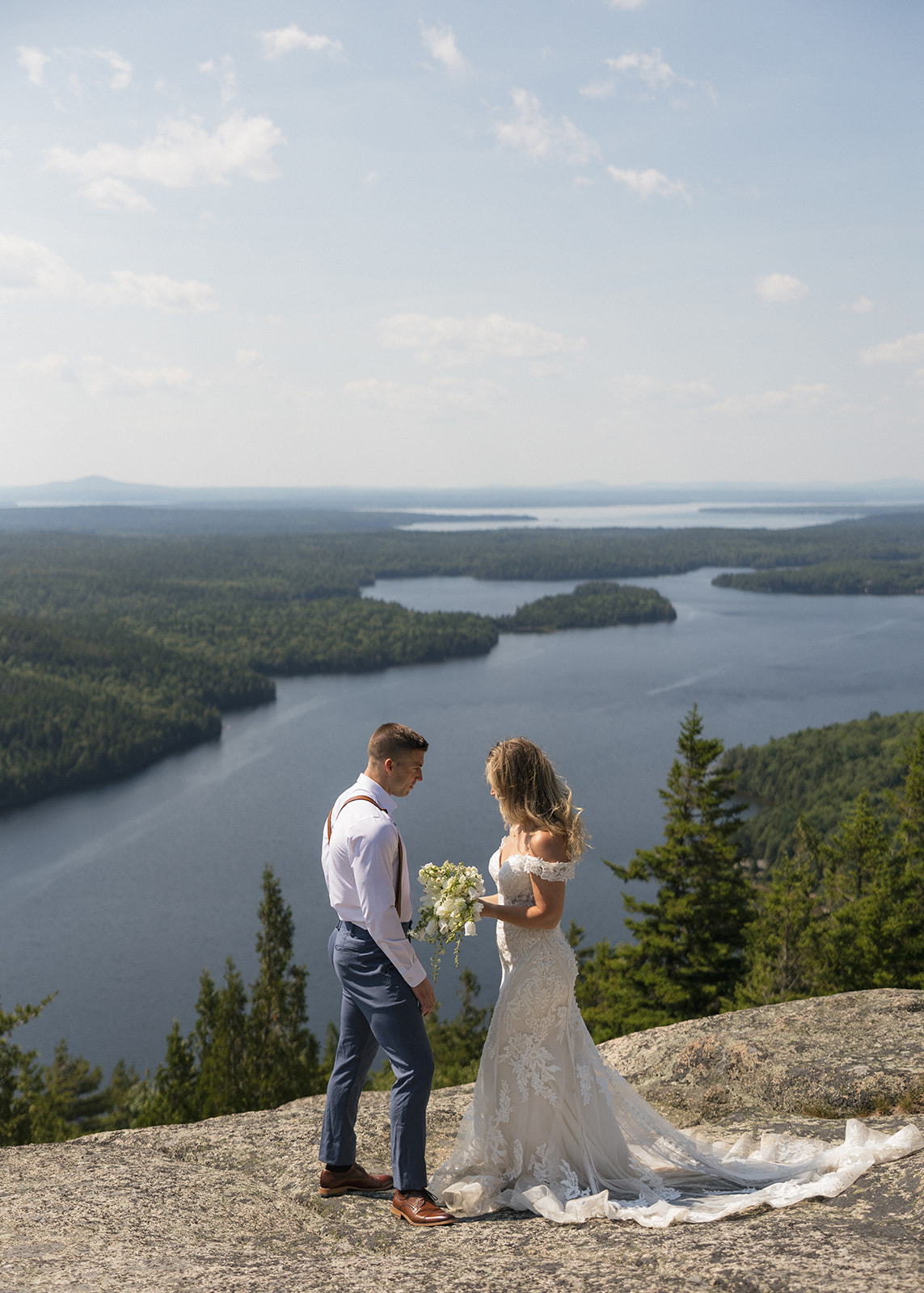 Bride and Groom saying private vows with a beautiful background in Acadia 