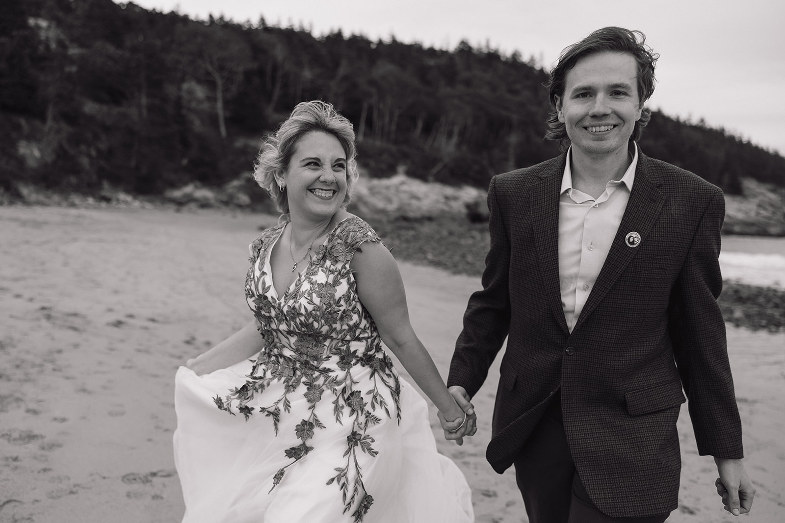 In love couple smiling while at Sand Beach 