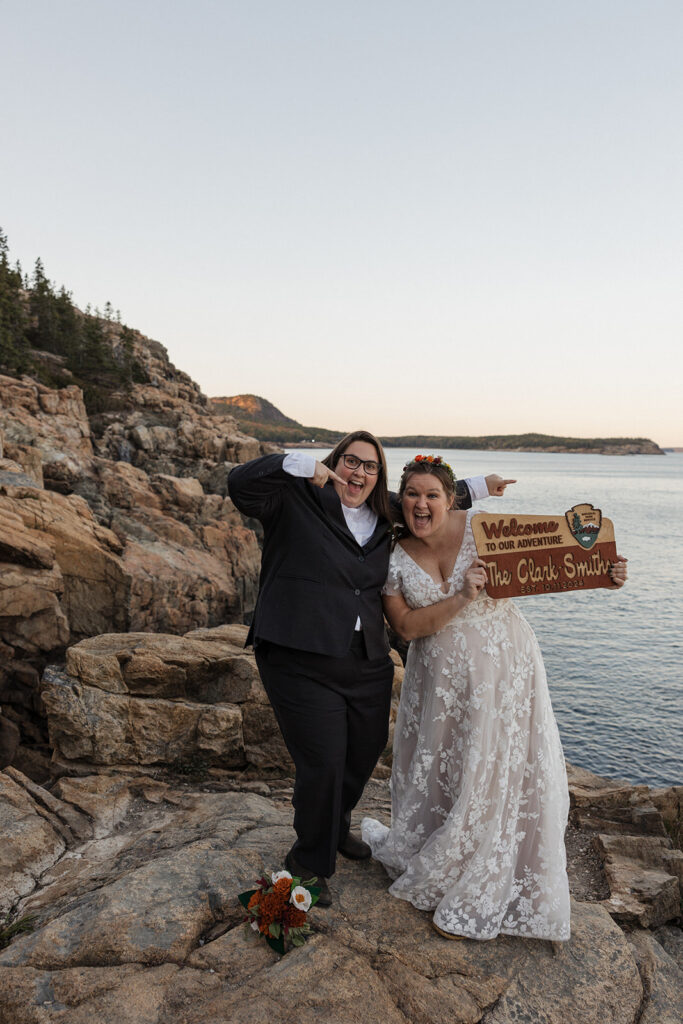 A couple celebrating saying I do on Otter Cliffs in Acadia National Park