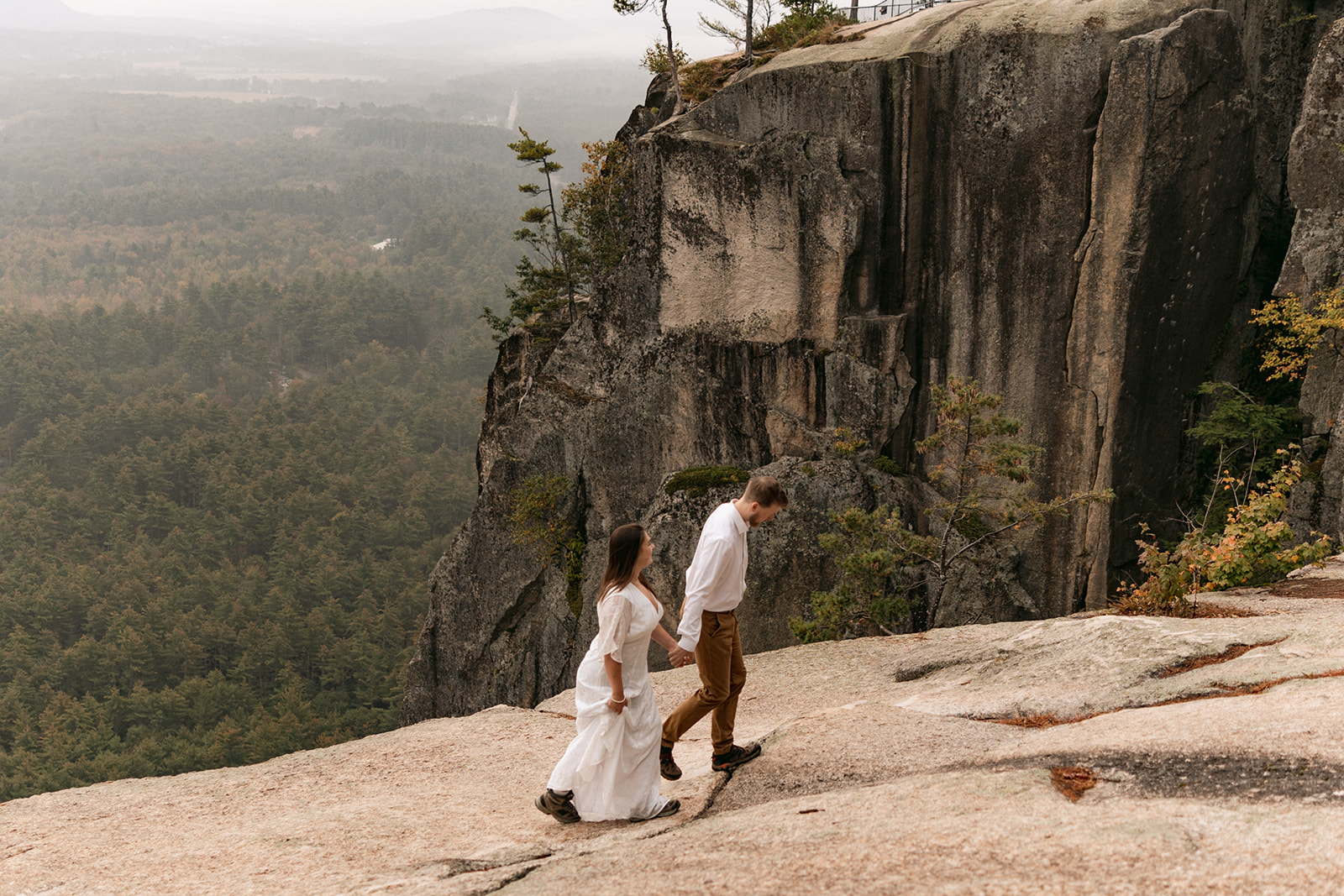 couple stand on cathedral ledge 