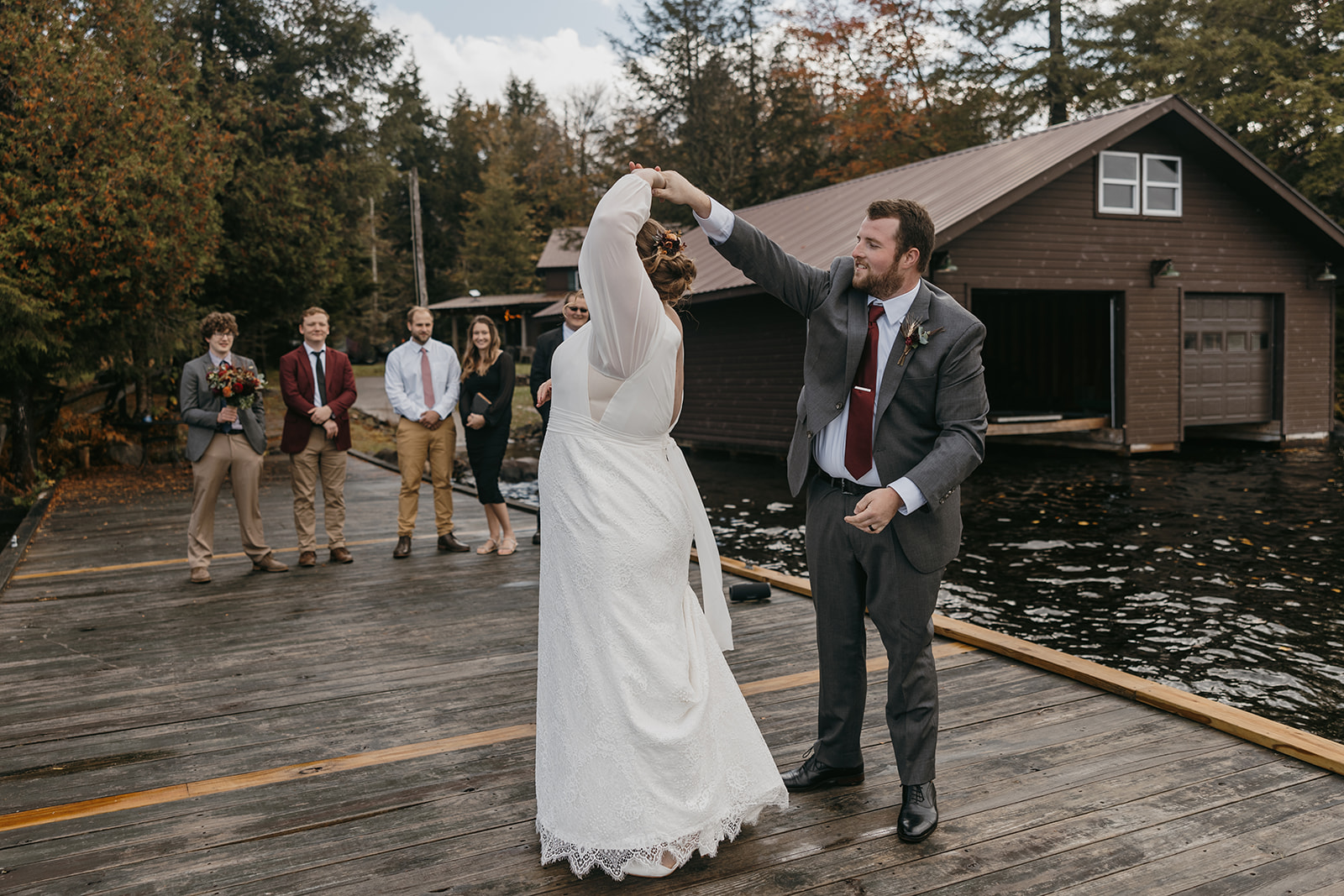 bride and groom exit their dreamy lake dock elopement ceremony