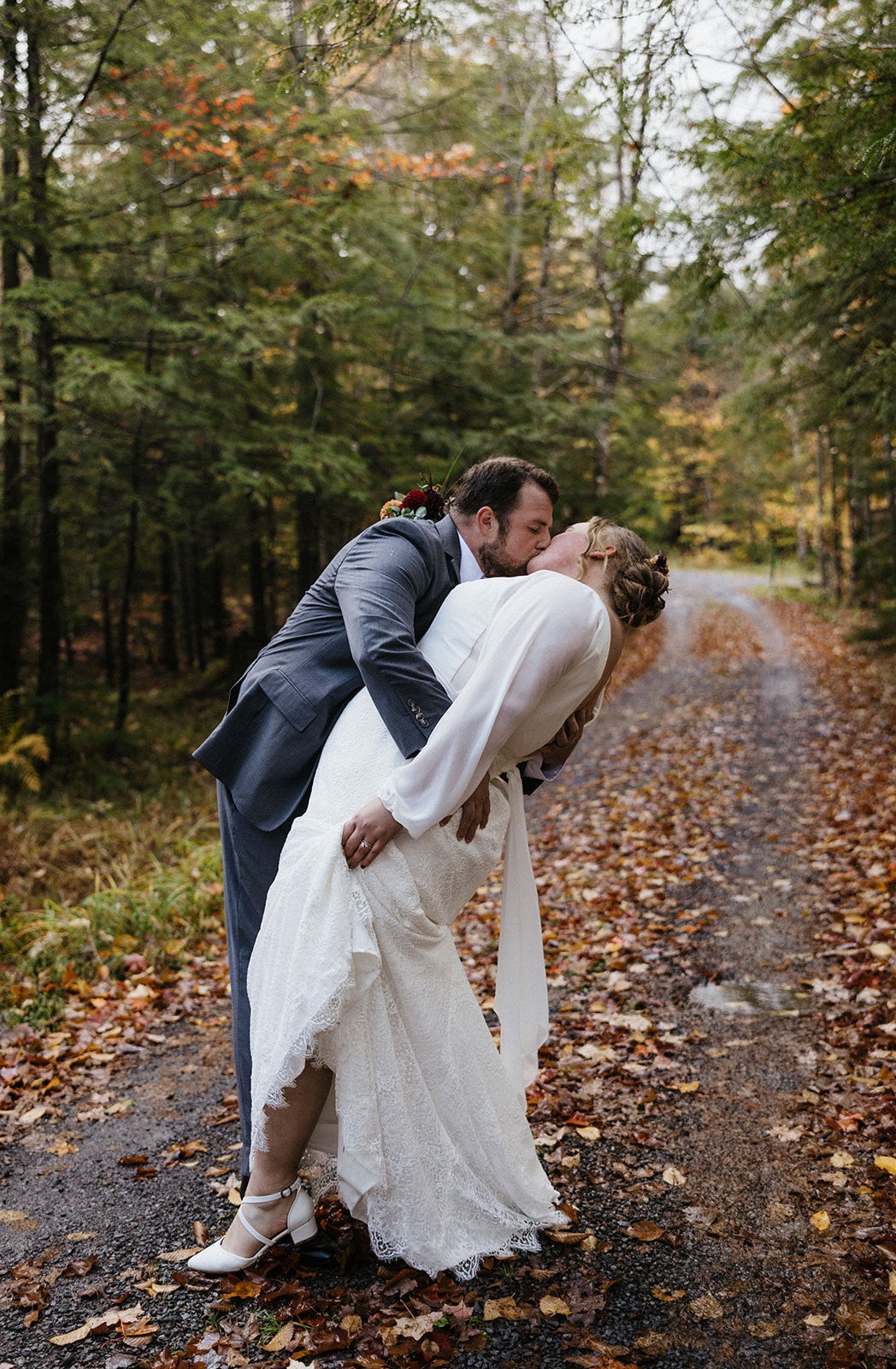 bride and groom hike through the Autumn foliage in upstate New York