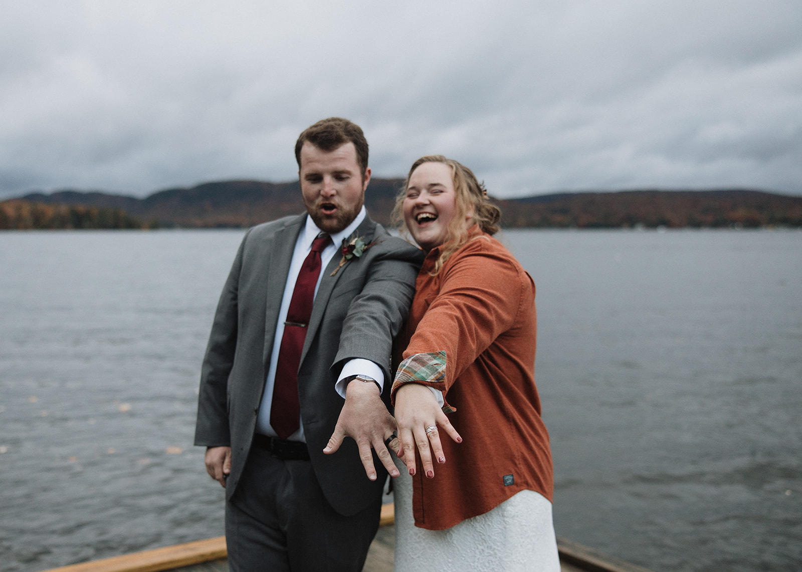 bride and groom showcase their new bling