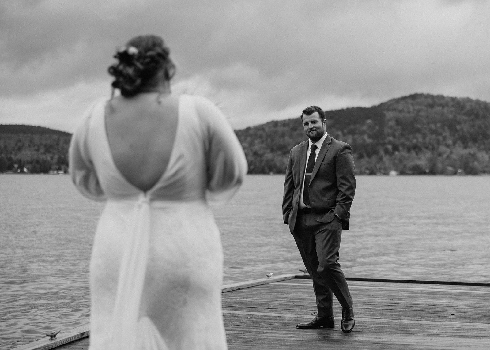 bride walks towards the docks for their emotional first look photoshoot