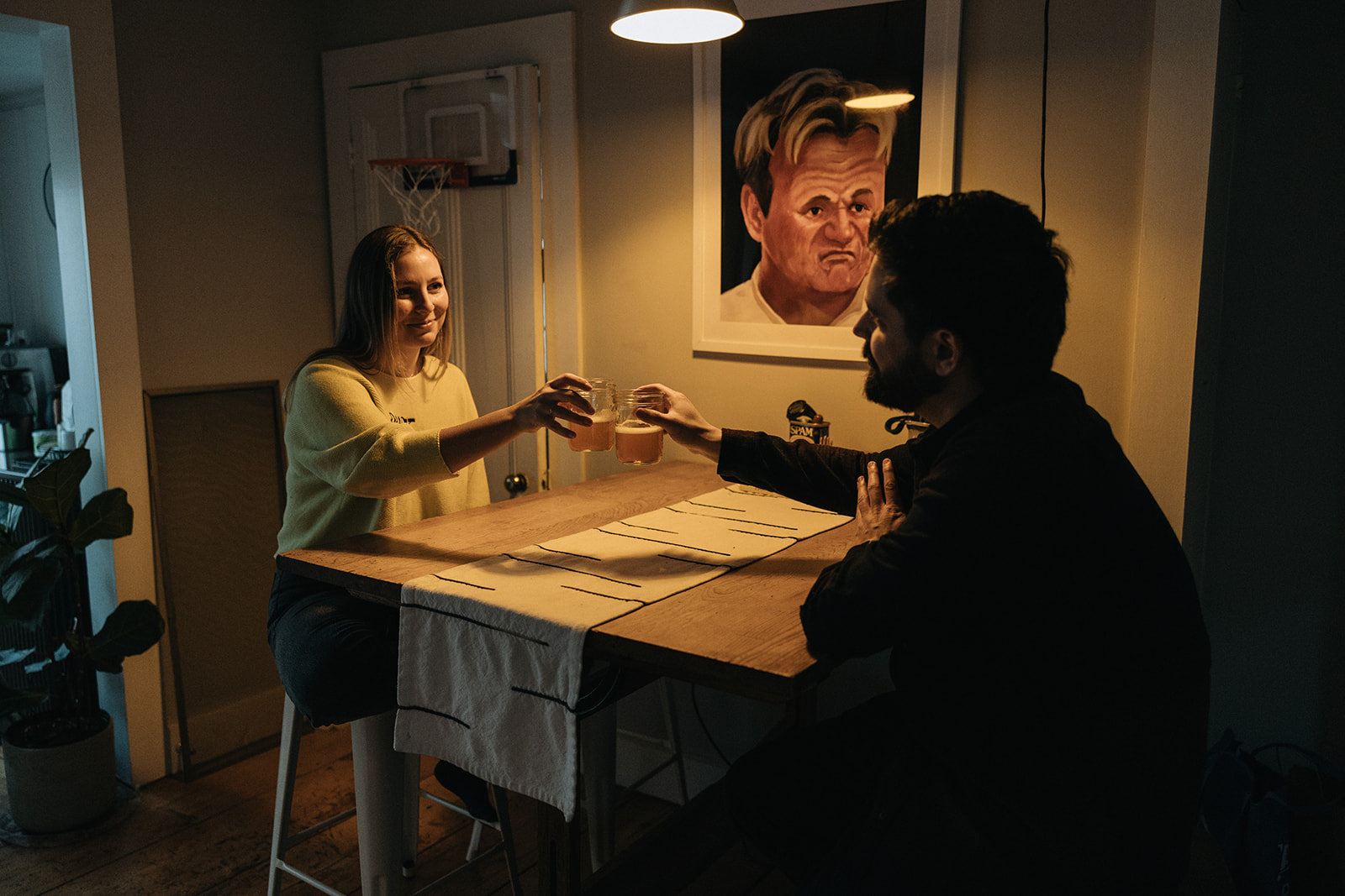 stunning couple pose in their home during their in home engagement photos