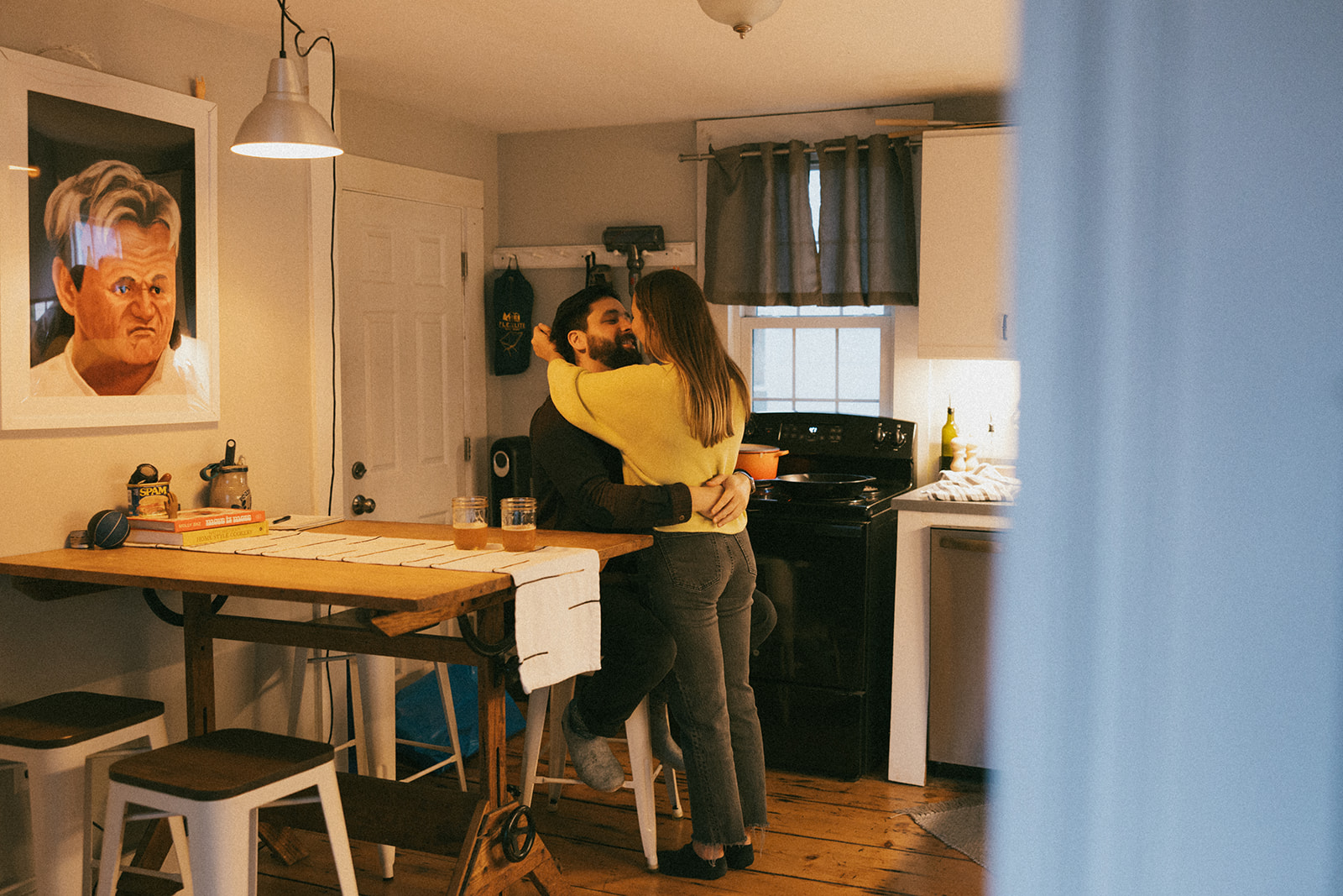 stunning couple pose in their home during their in home en