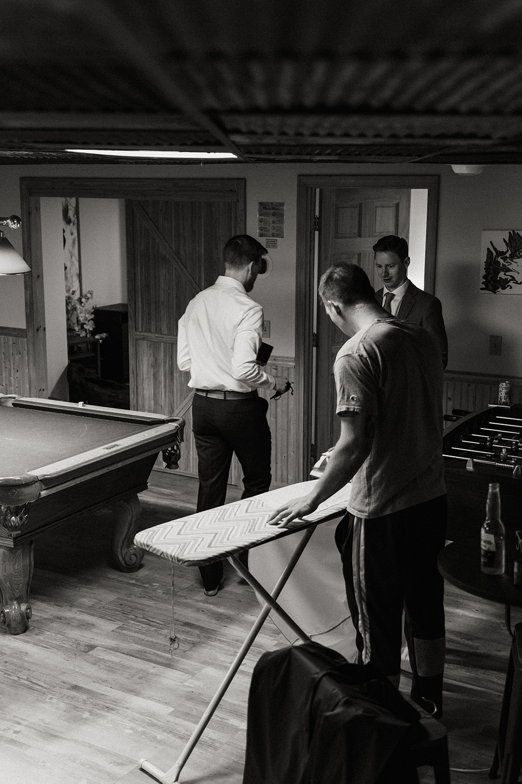 groom and groomsmen celebrate with pool and beer before the elopement ceremony