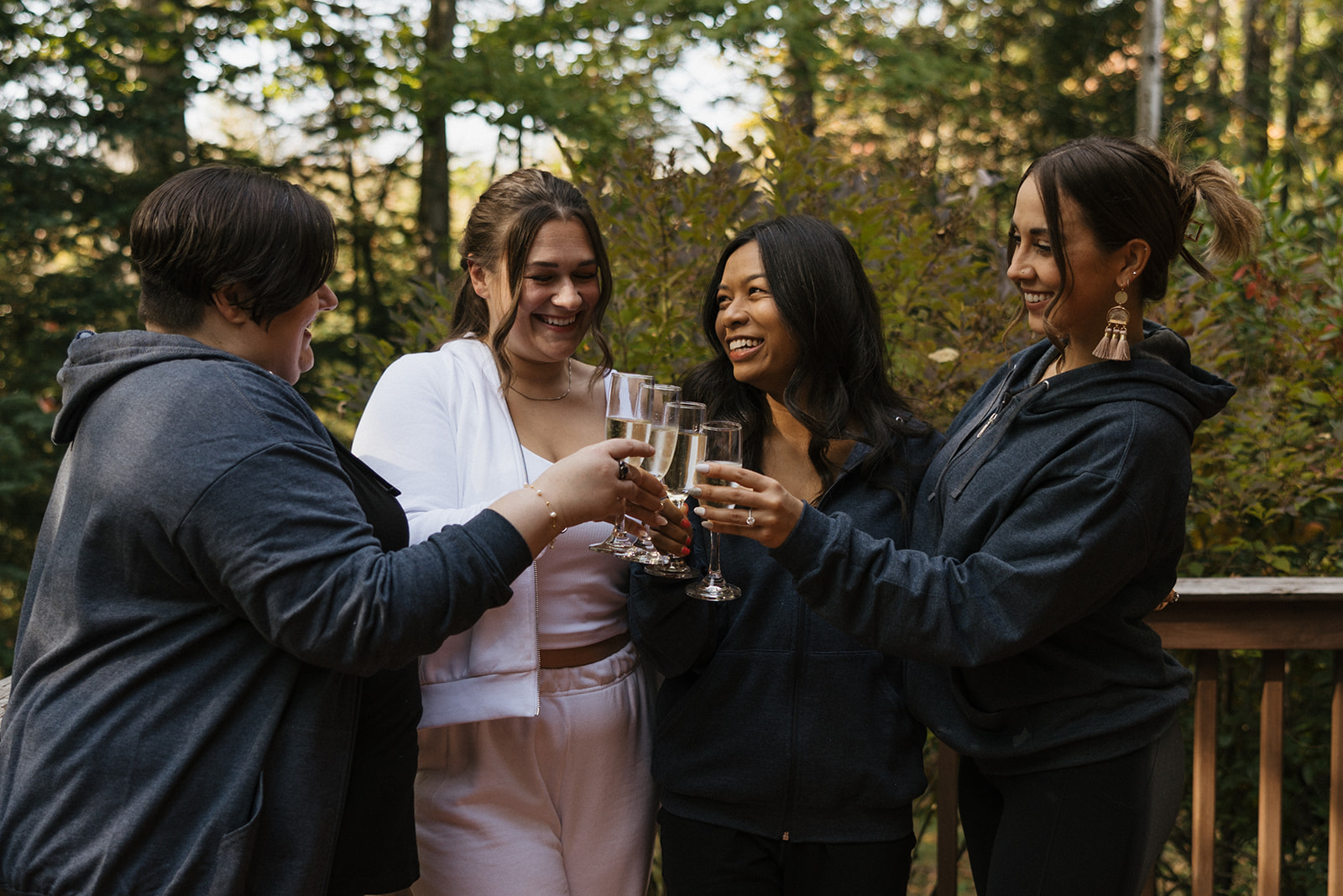 bride celebrates with her bridesmaids before her Echo lake elopement
