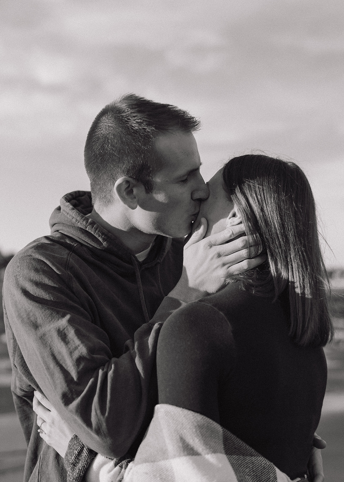 beautiful couple pose on an East Coast beach during their engagement photoshoot