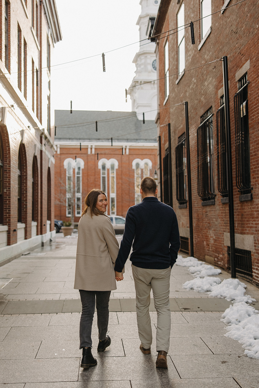 beautiful couple pose in a New Hampshire town