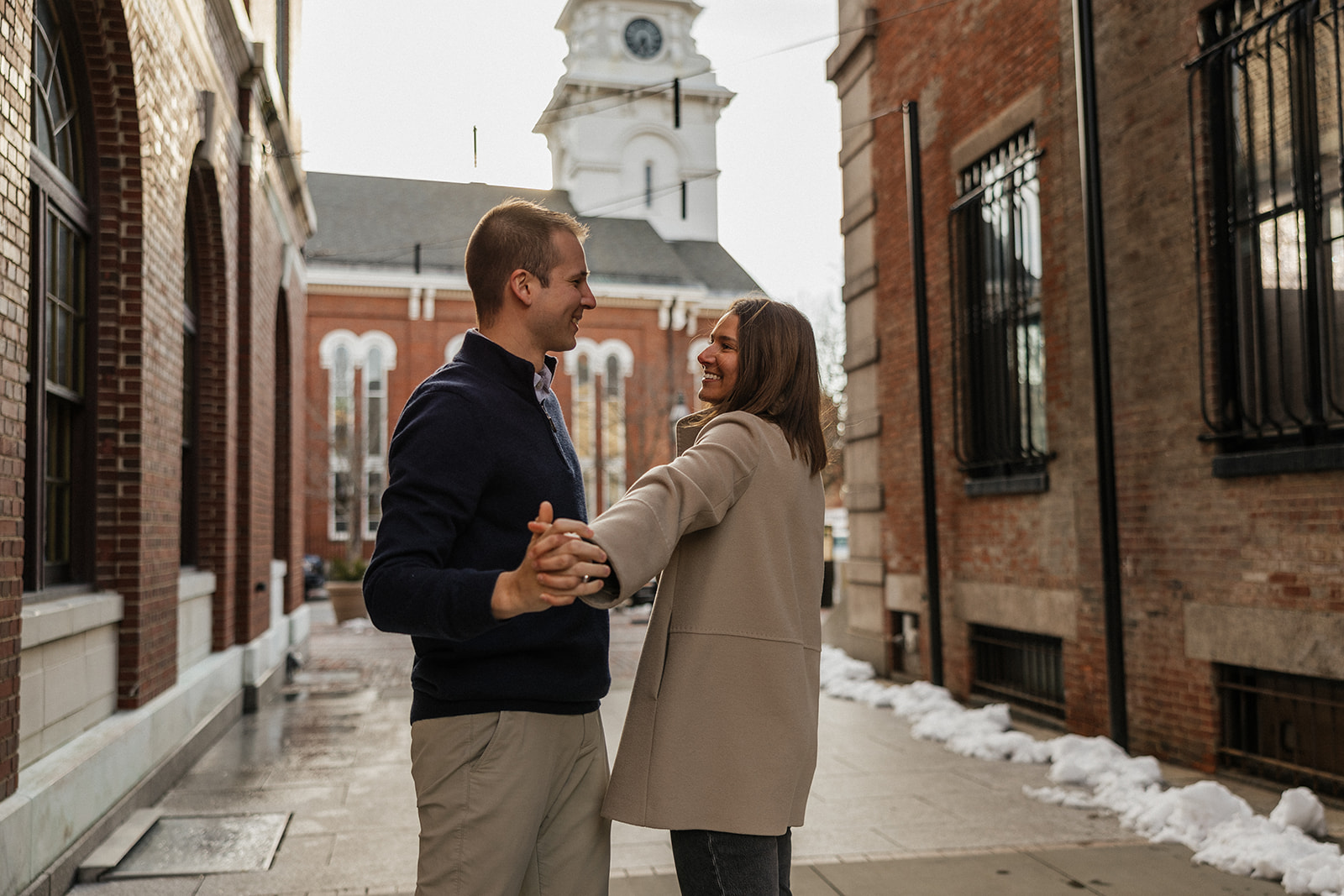 beautiful couple pose in a New Hampshire town