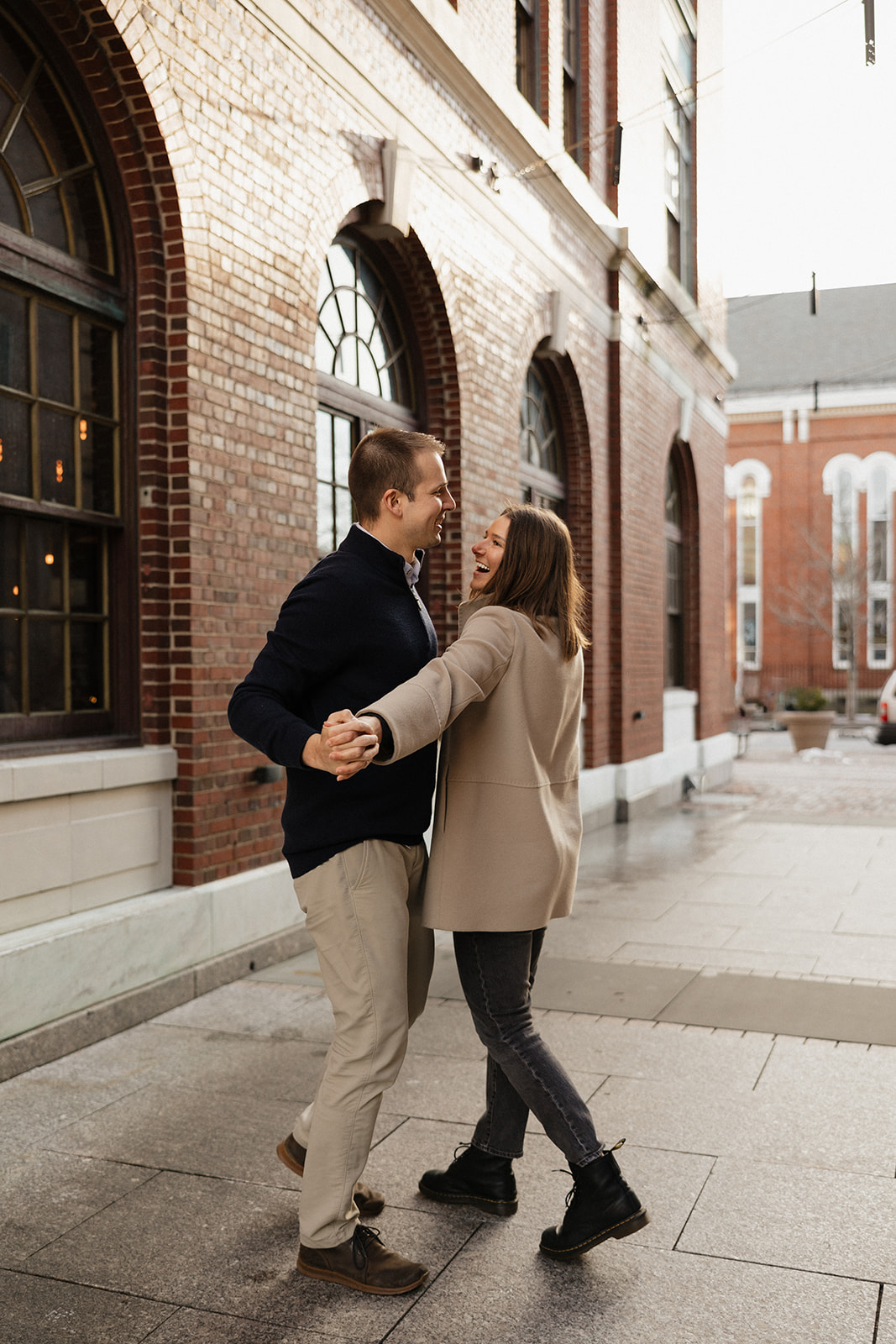 beautiful couple walk on the Seacoast town streets