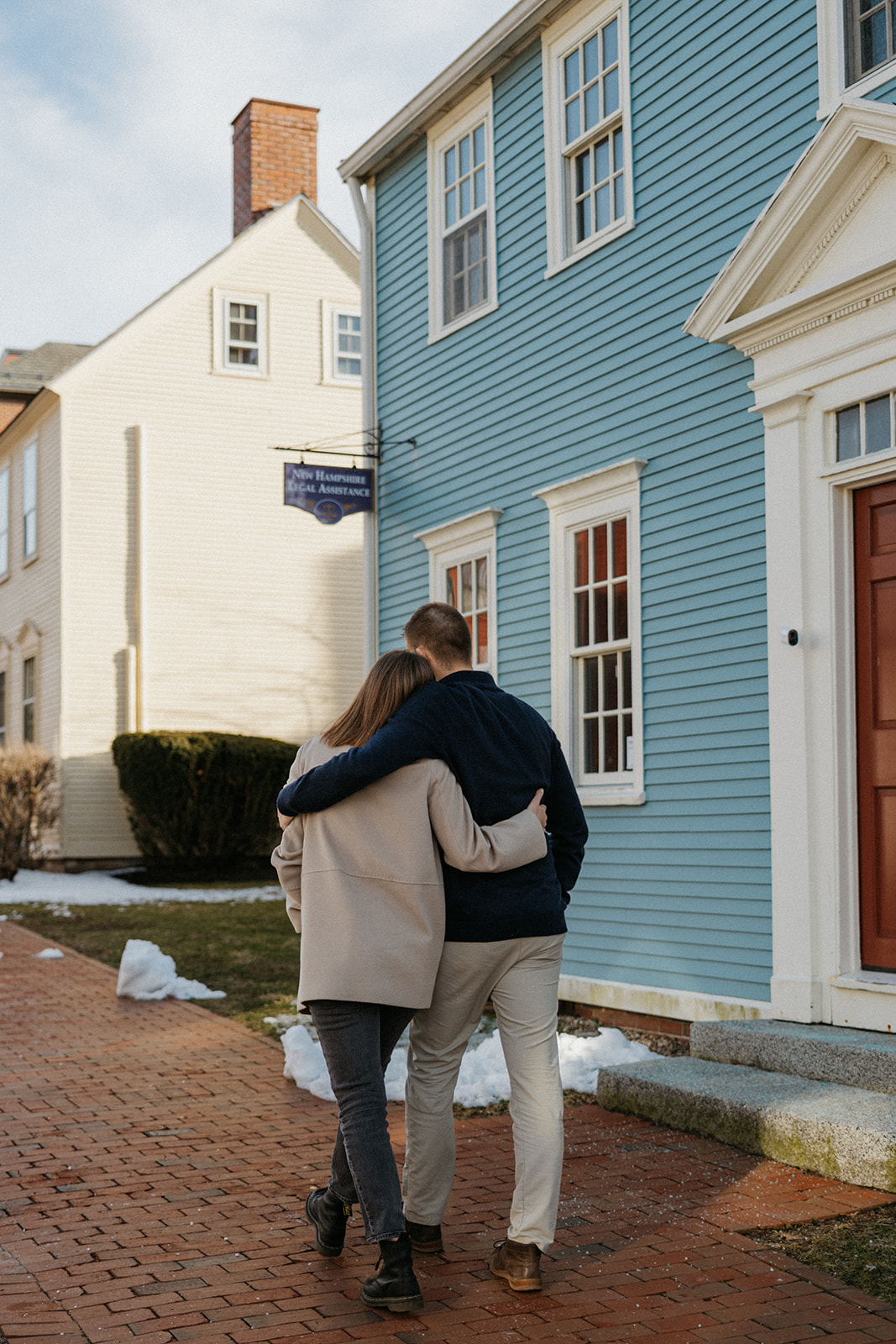 beautiful couple pose in a New Hampshire town