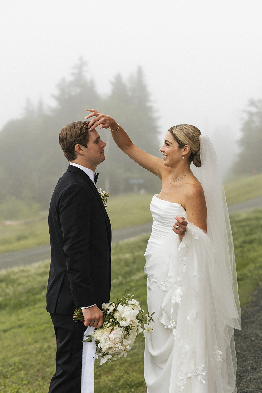 beautiful bride and groom take a candid photo together 