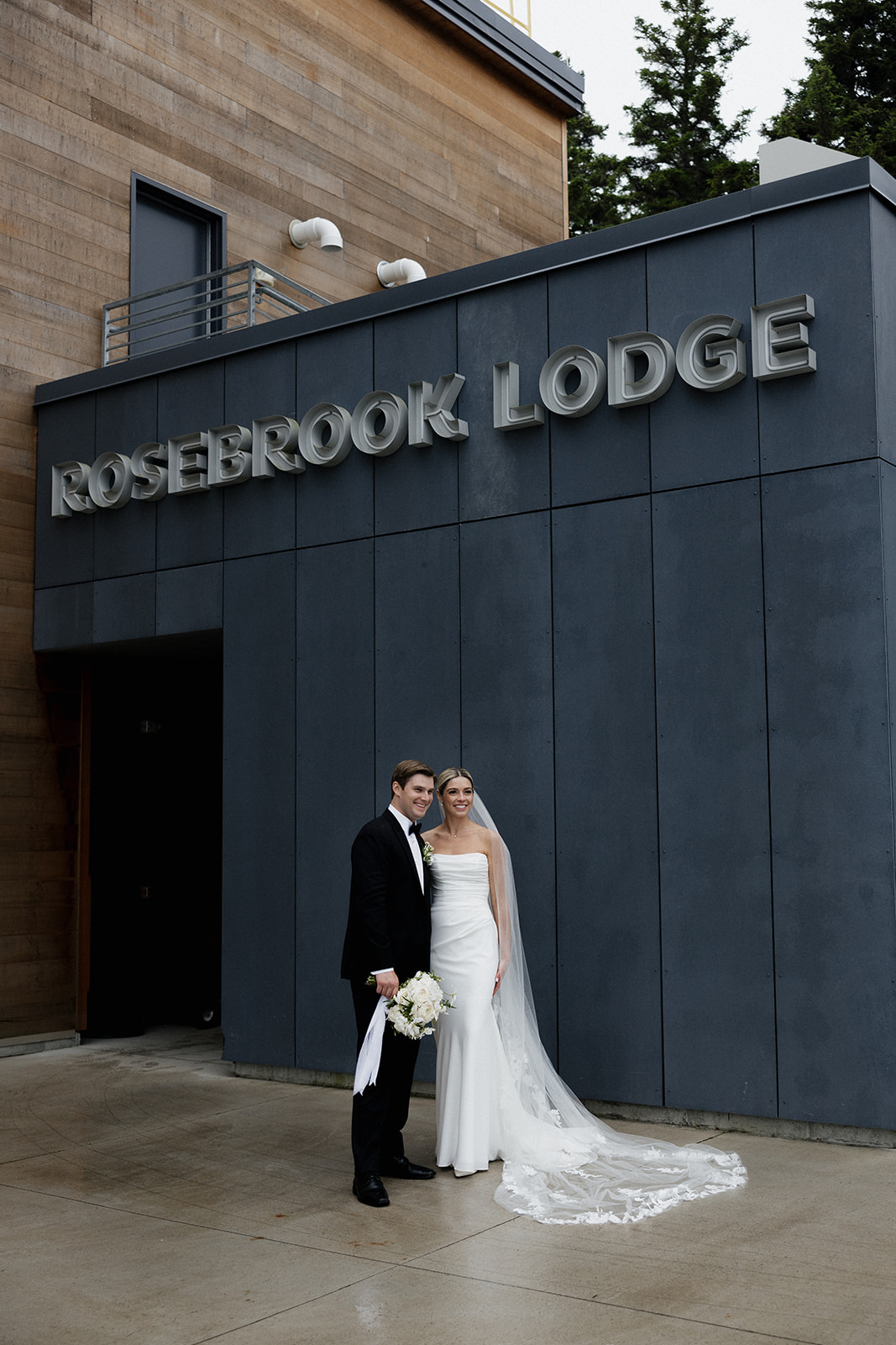 beautiful bride and groom pose together after their New Hampshire wedding day