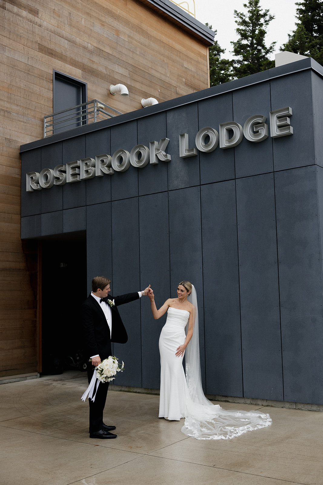 beautiful bride and groom take a candid photo together 