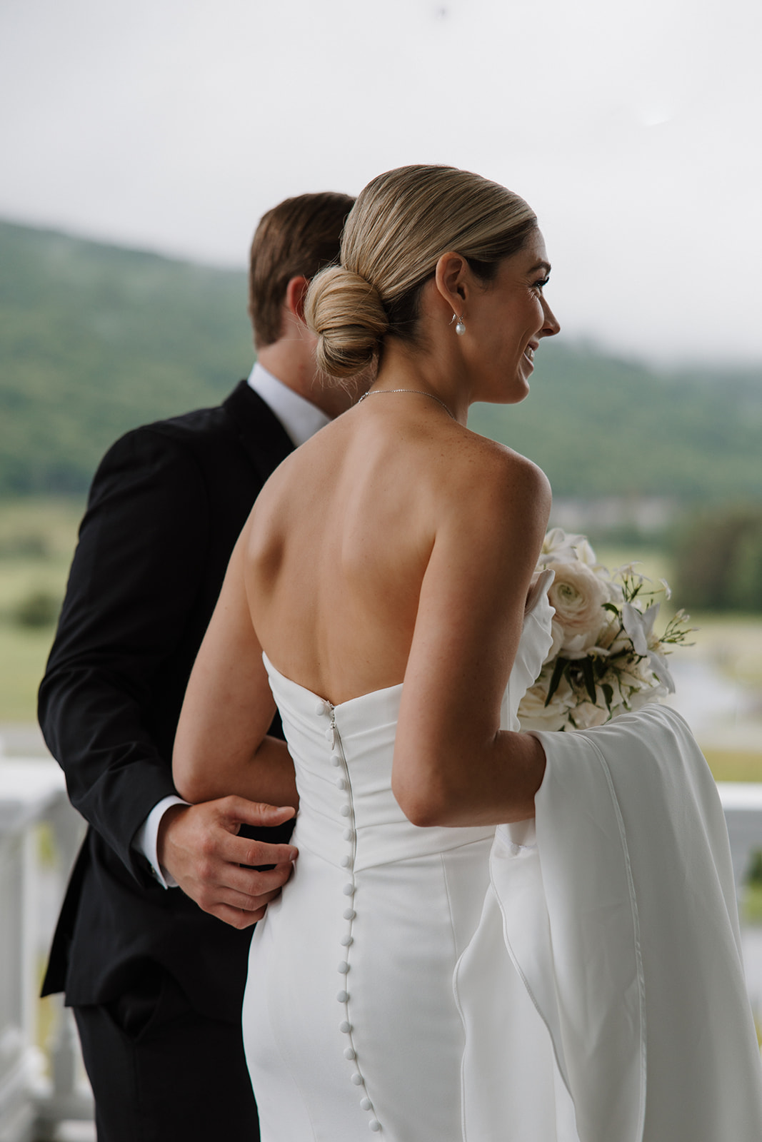 beautiful bride and groom take a candid photo together 