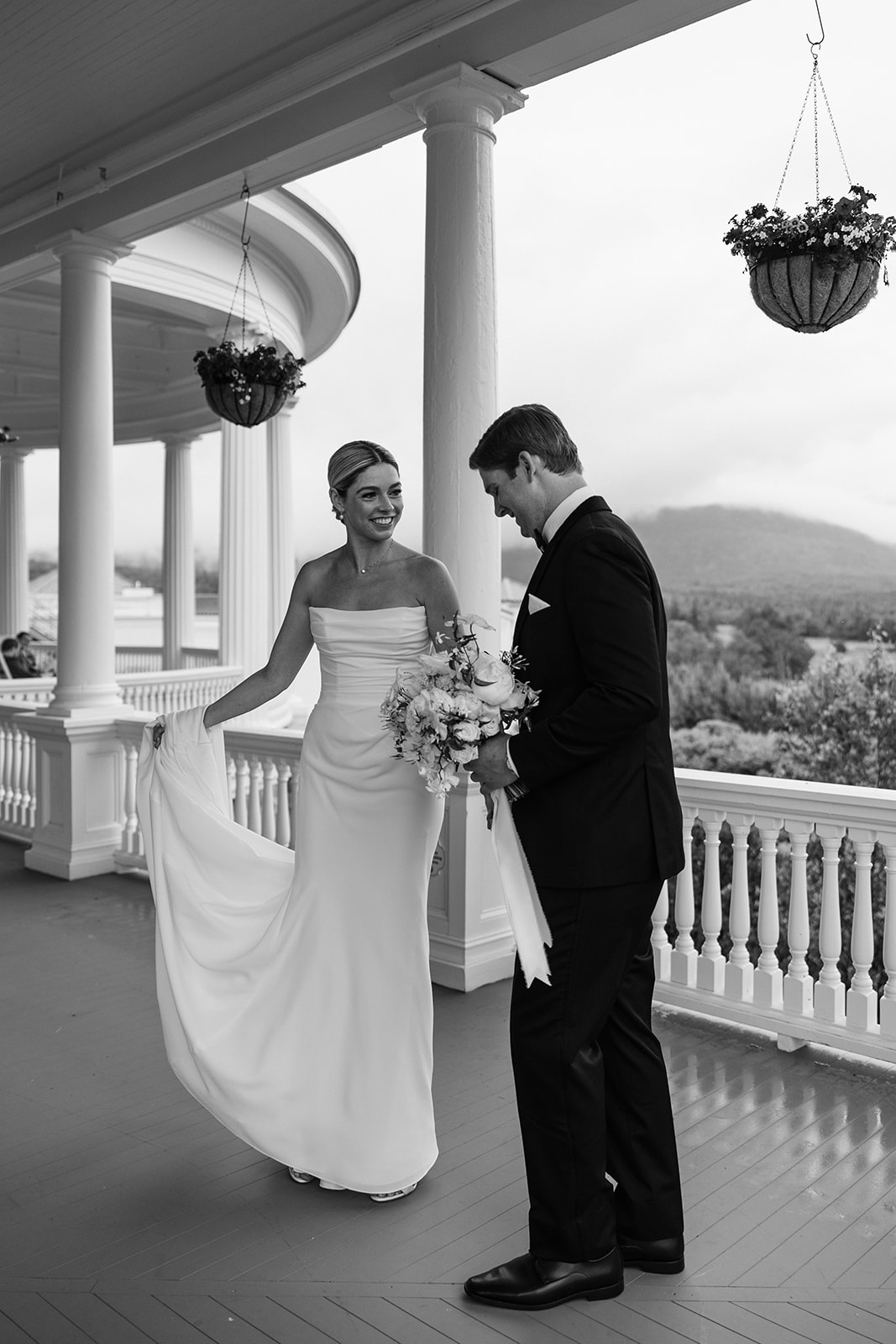 beautiful bride and groom take a candid photo together 