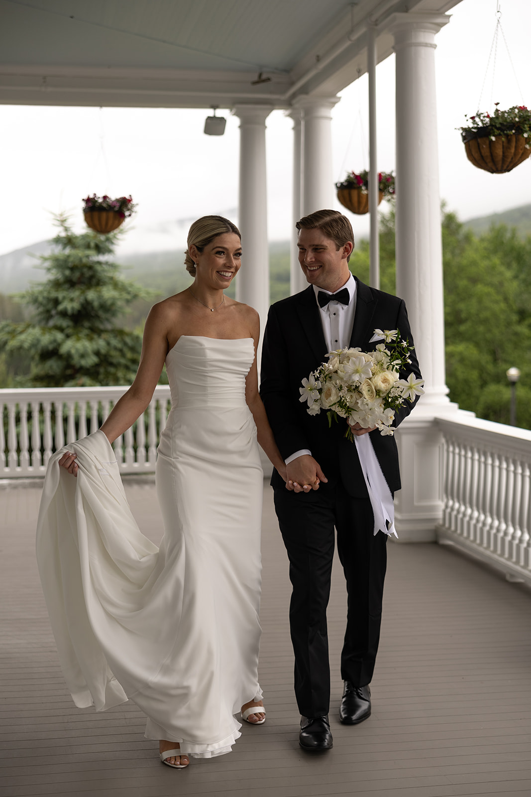 beautiful bride and groom take a candid photo together 