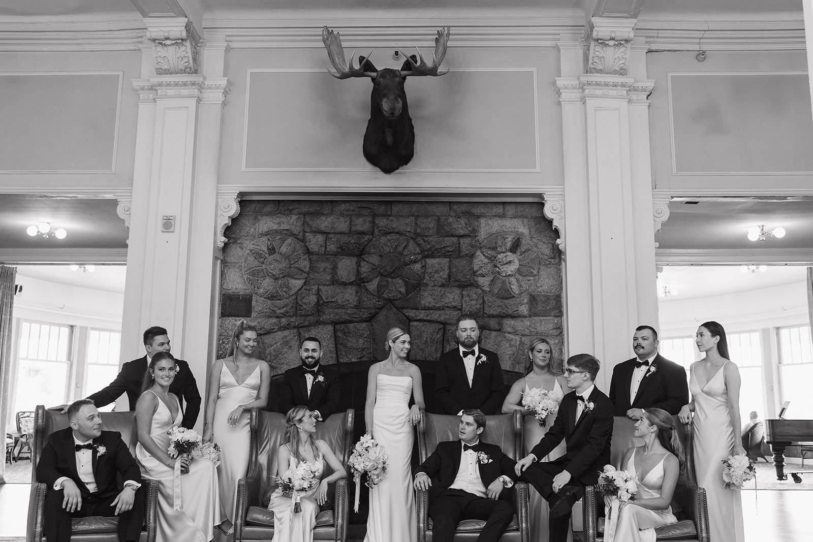 wedding party poses together after a rainy wedding day