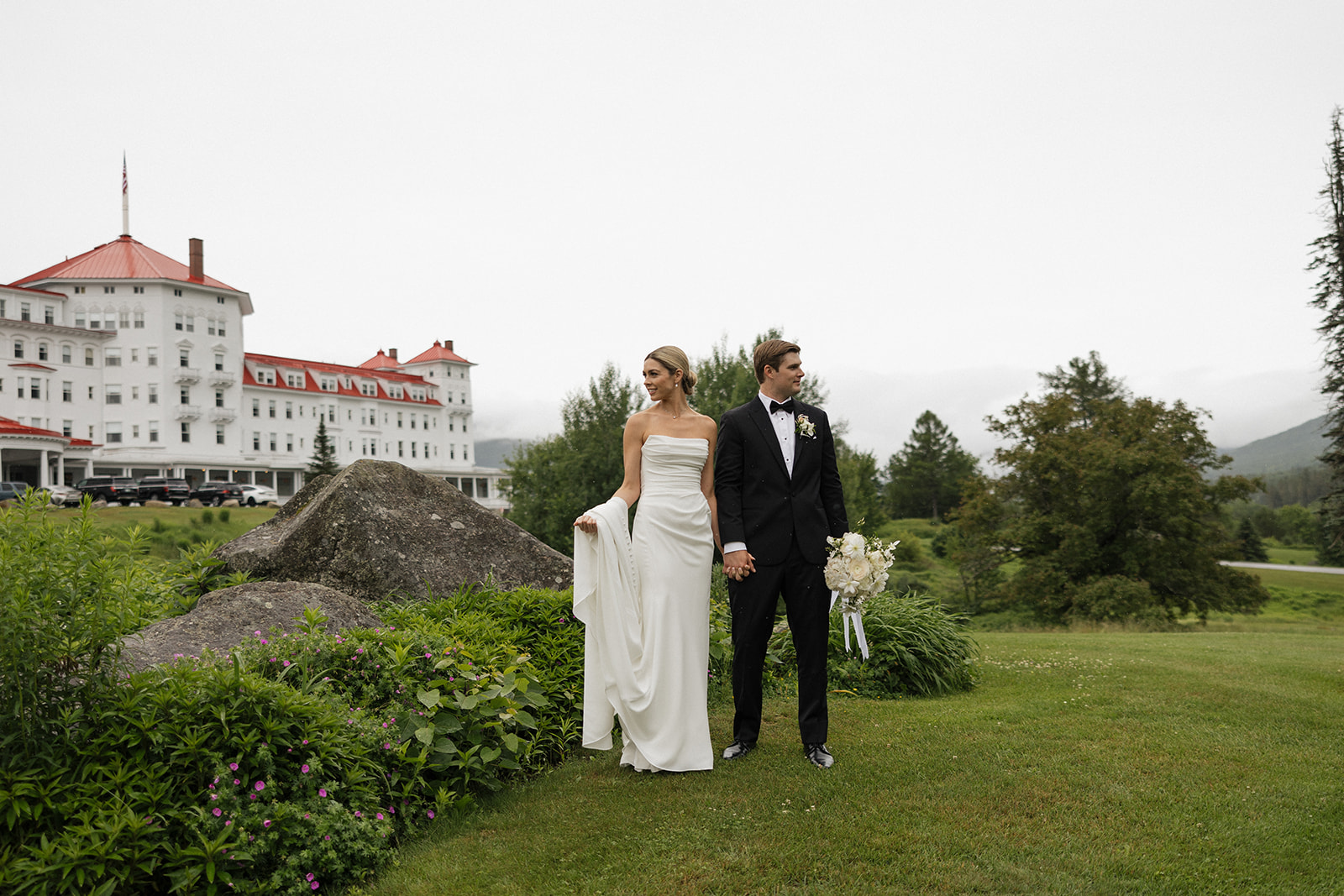 beautiful bride and groom take a candid photo together 