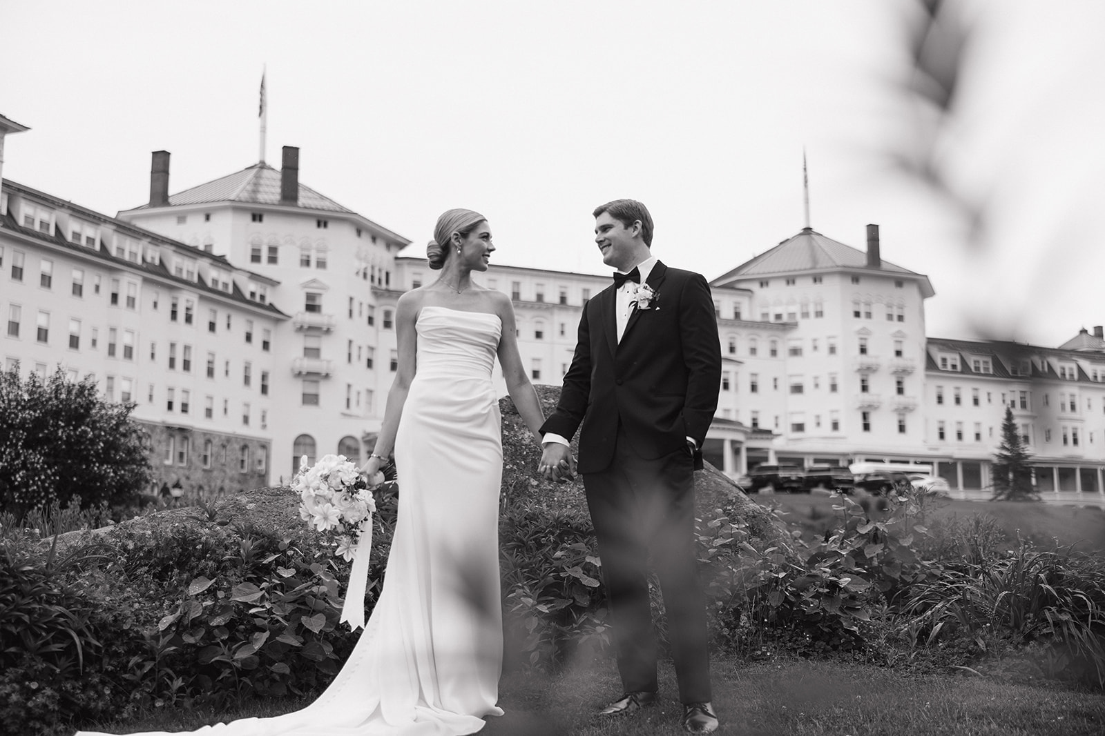 beautiful bride and groom take a candid photo together 