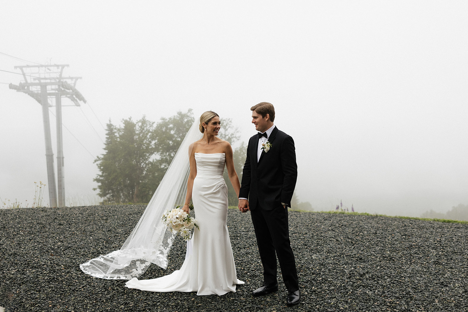 beautiful bride and groom take a candid photo together 