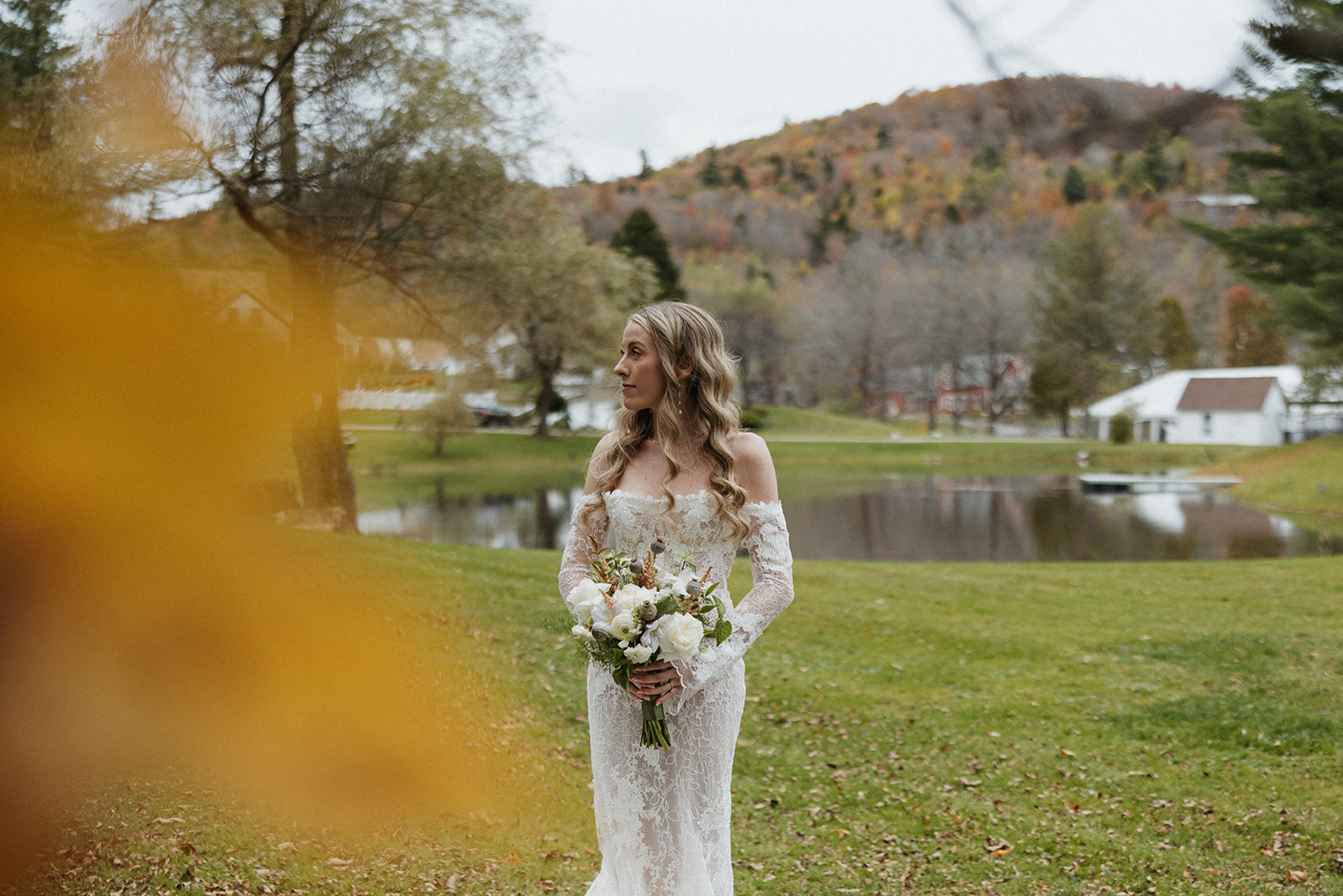 beautiful bride poses for a photo during her Vermont wedding day