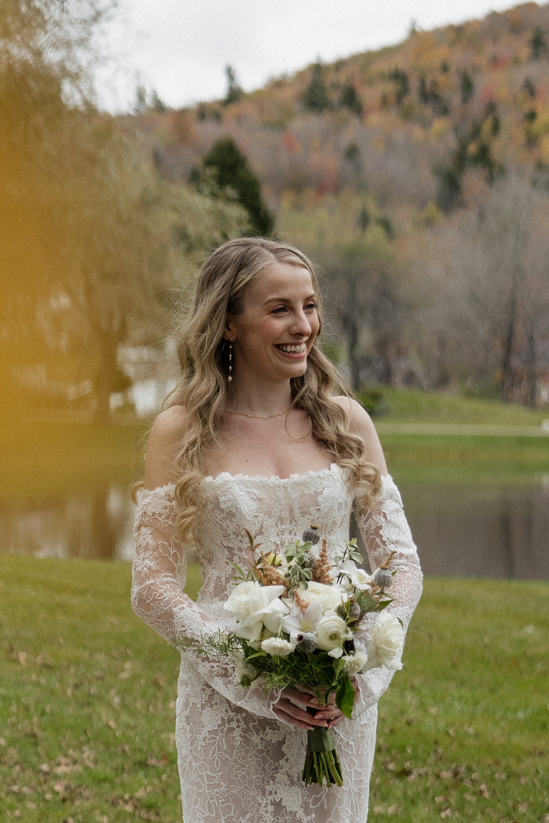 beautiful bride poses for a photo during her Vermont wedding day