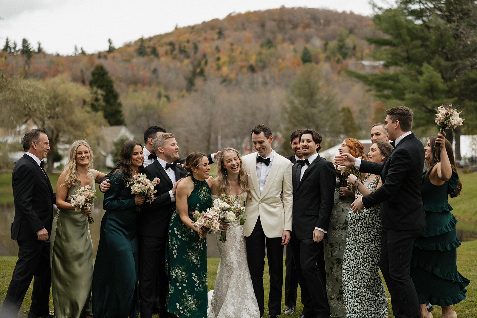 wedding party poses for a photo outside their vermont wedding day