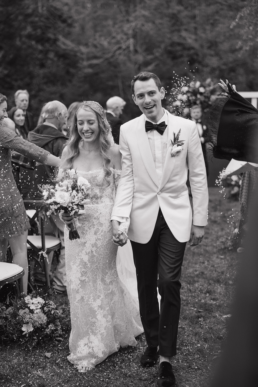 bride and groom exit their dreamy Vermont wedding ceremony