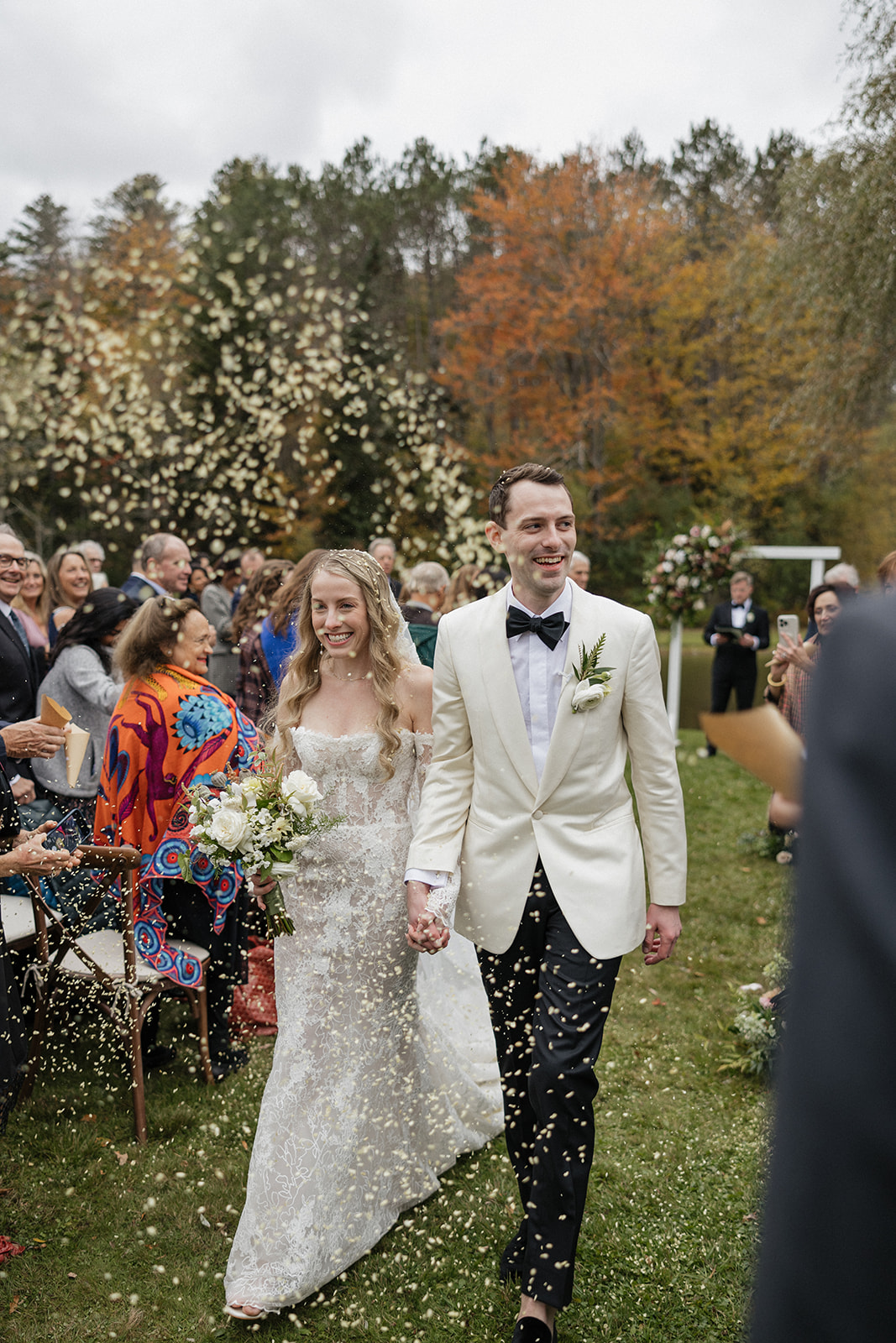 bride and groom exit their dreamy Vermont wedding ceremony