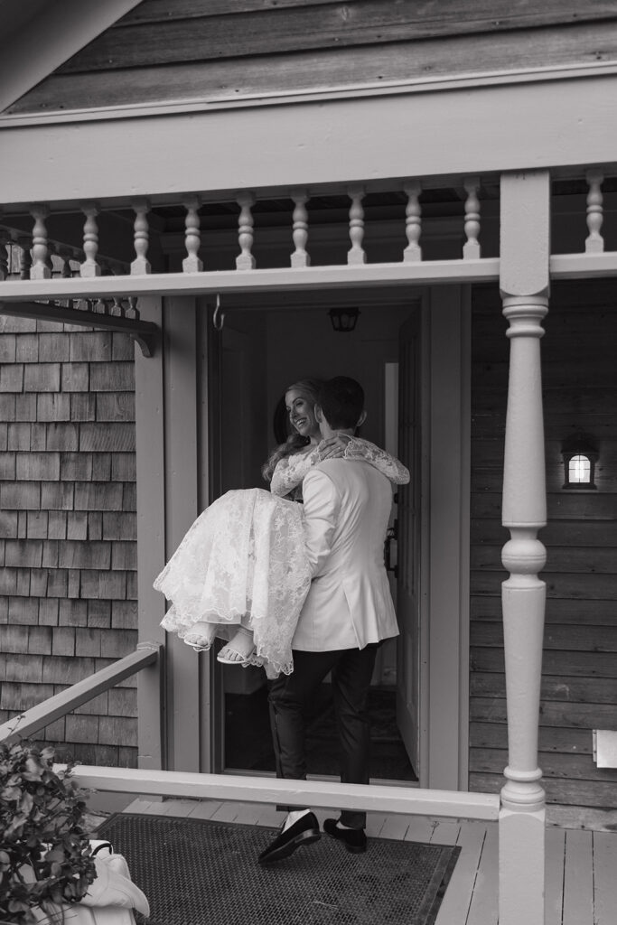 groom carries his bride