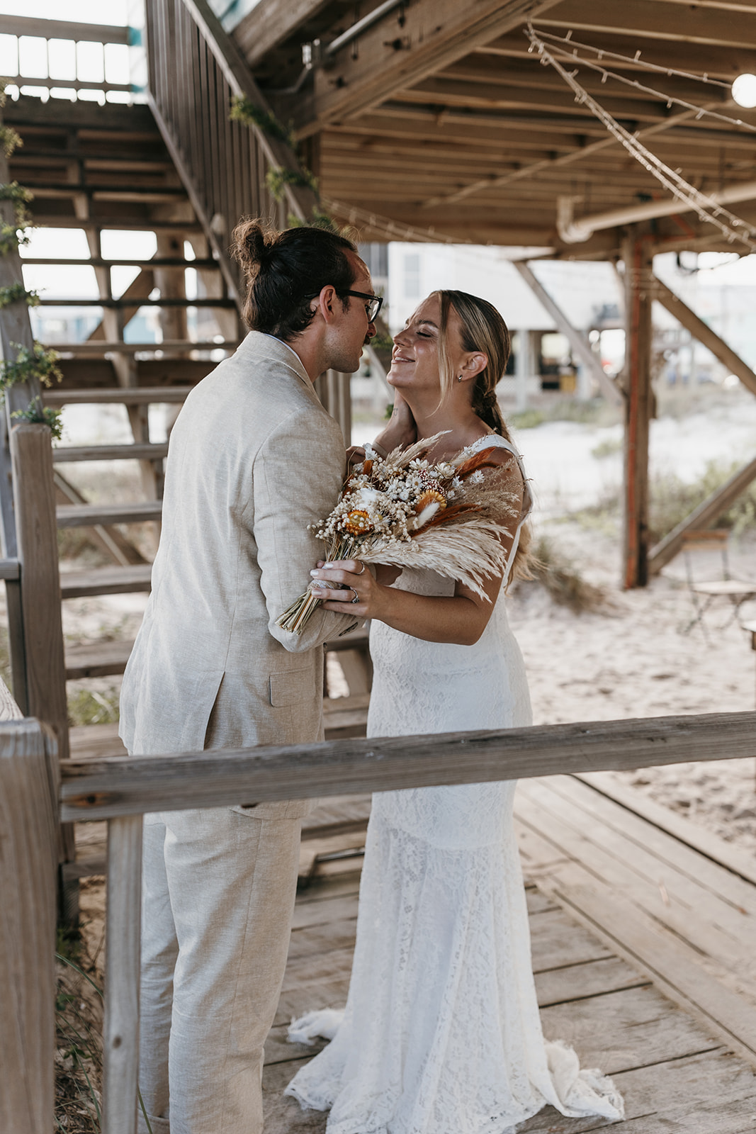 beautiful bride and groom pose together