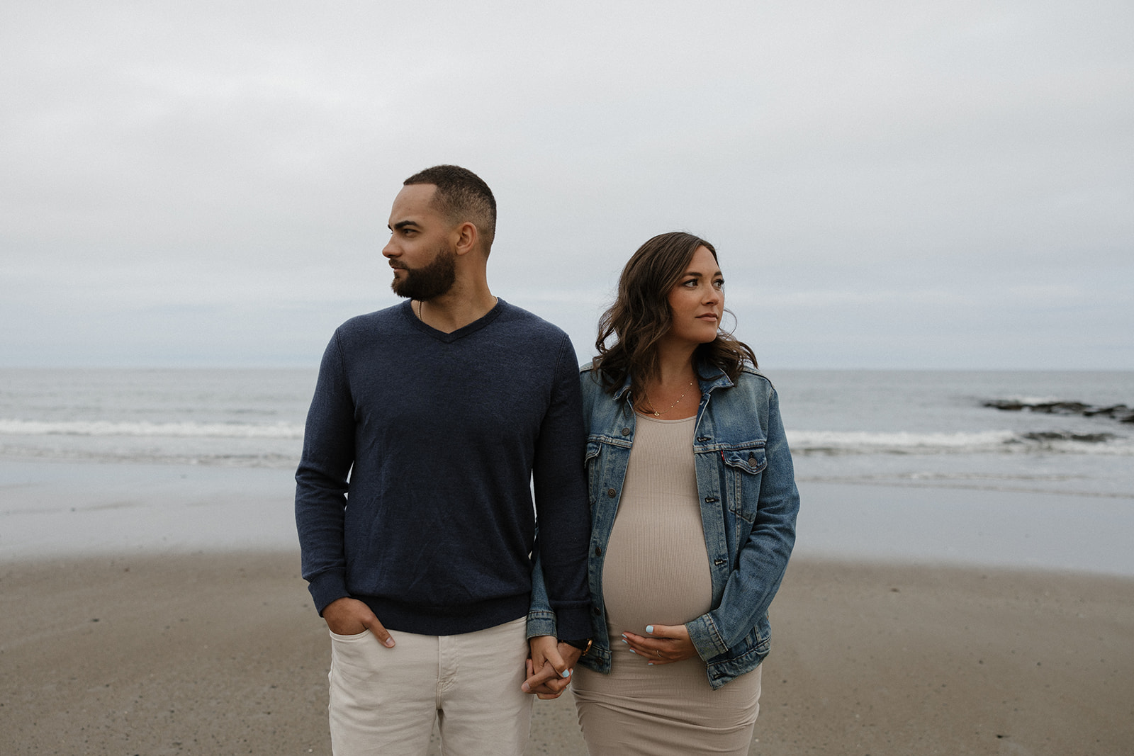 beautiful couple pose together on the beach