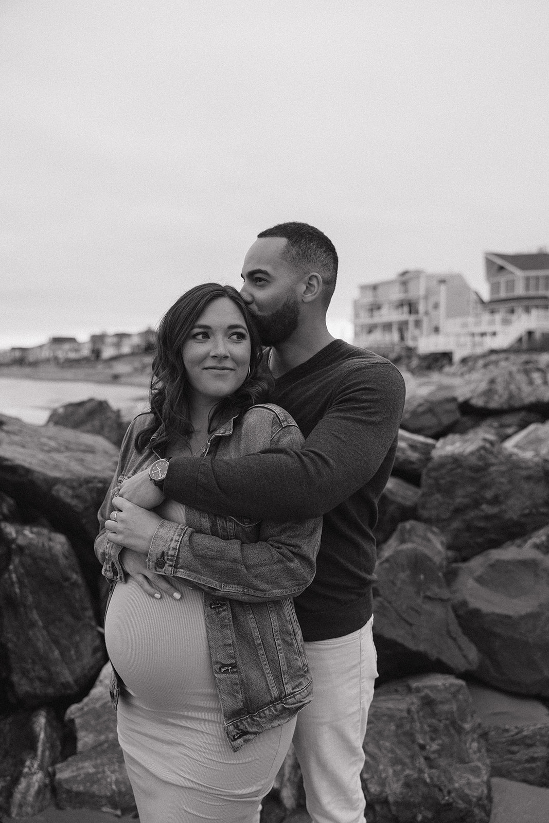 beautiful couple pose together on the beach