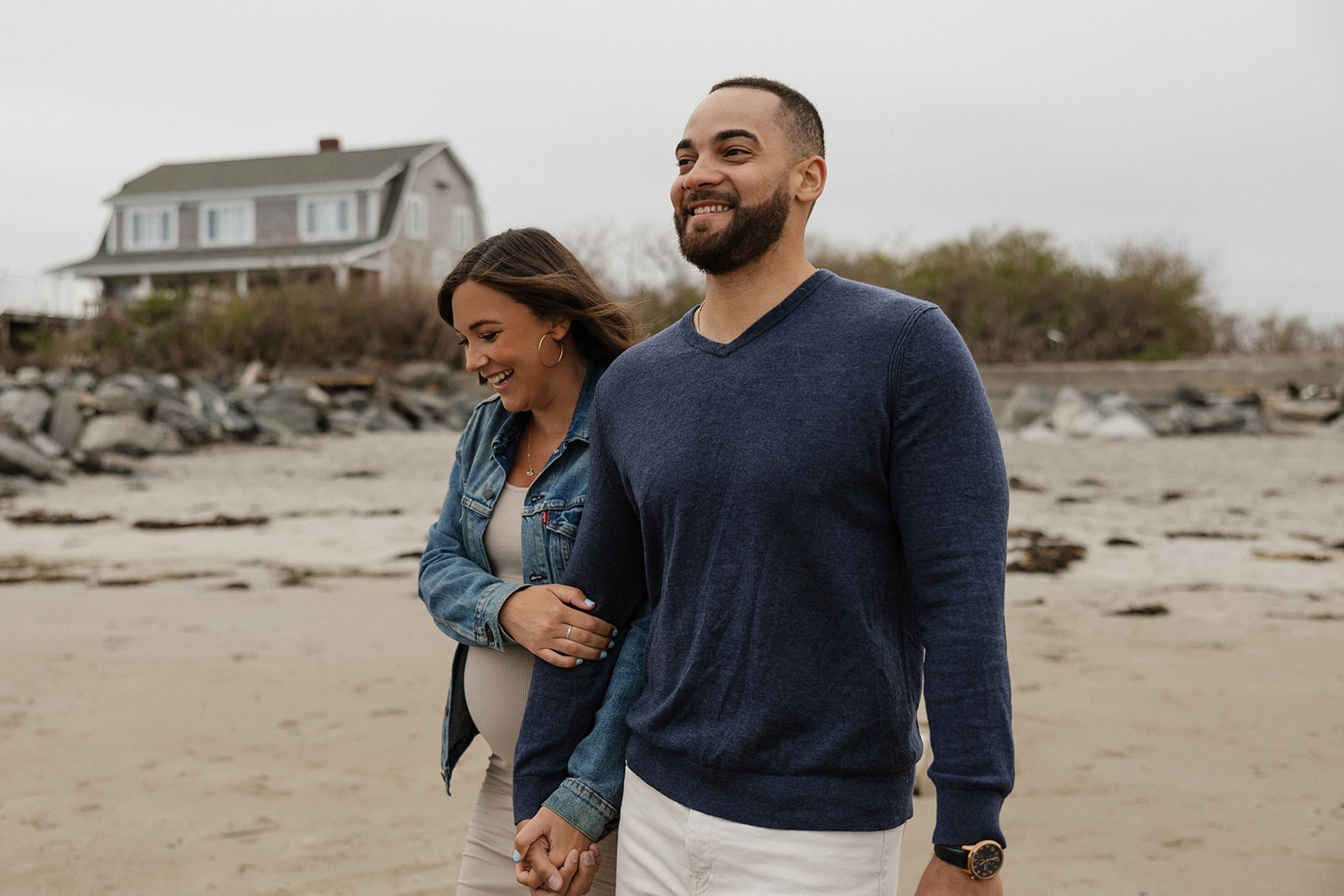 beautiful couple pose together on the beach