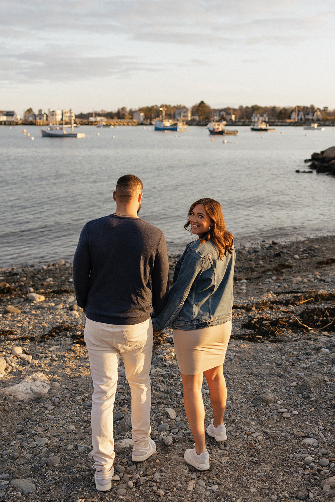 beautiful couple pose together on the beach