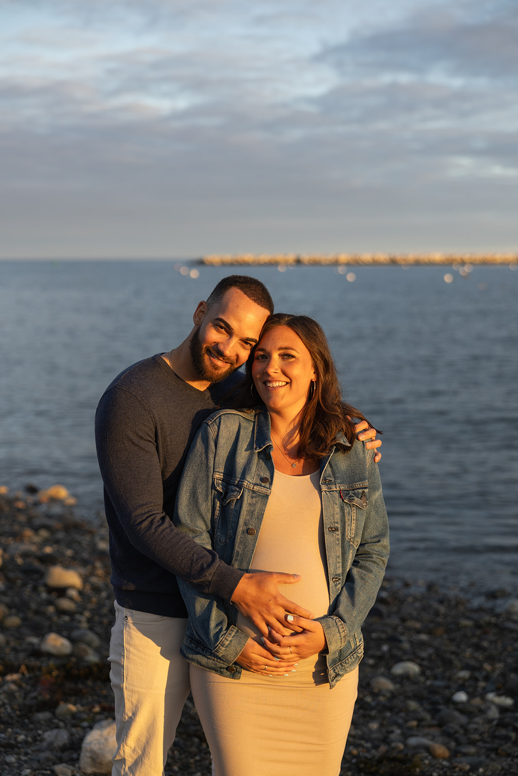 beautiful couple pose together on the beach