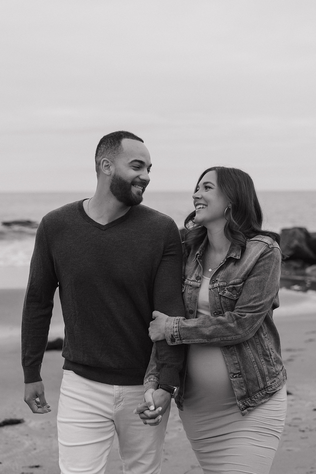 beautiful couple pose together on the beach