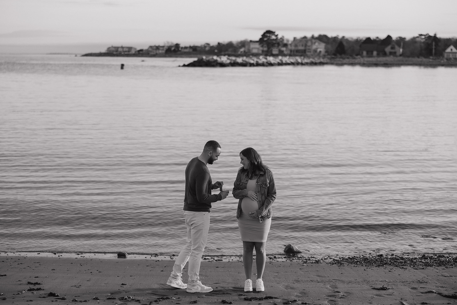 beautiful couple pose together on the beach