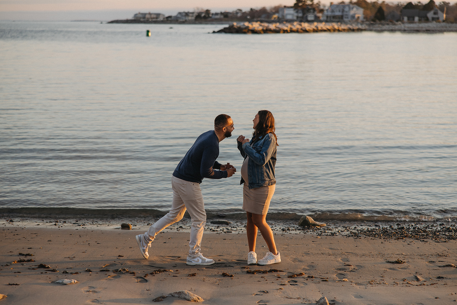 beautiful couple pose together on the beach